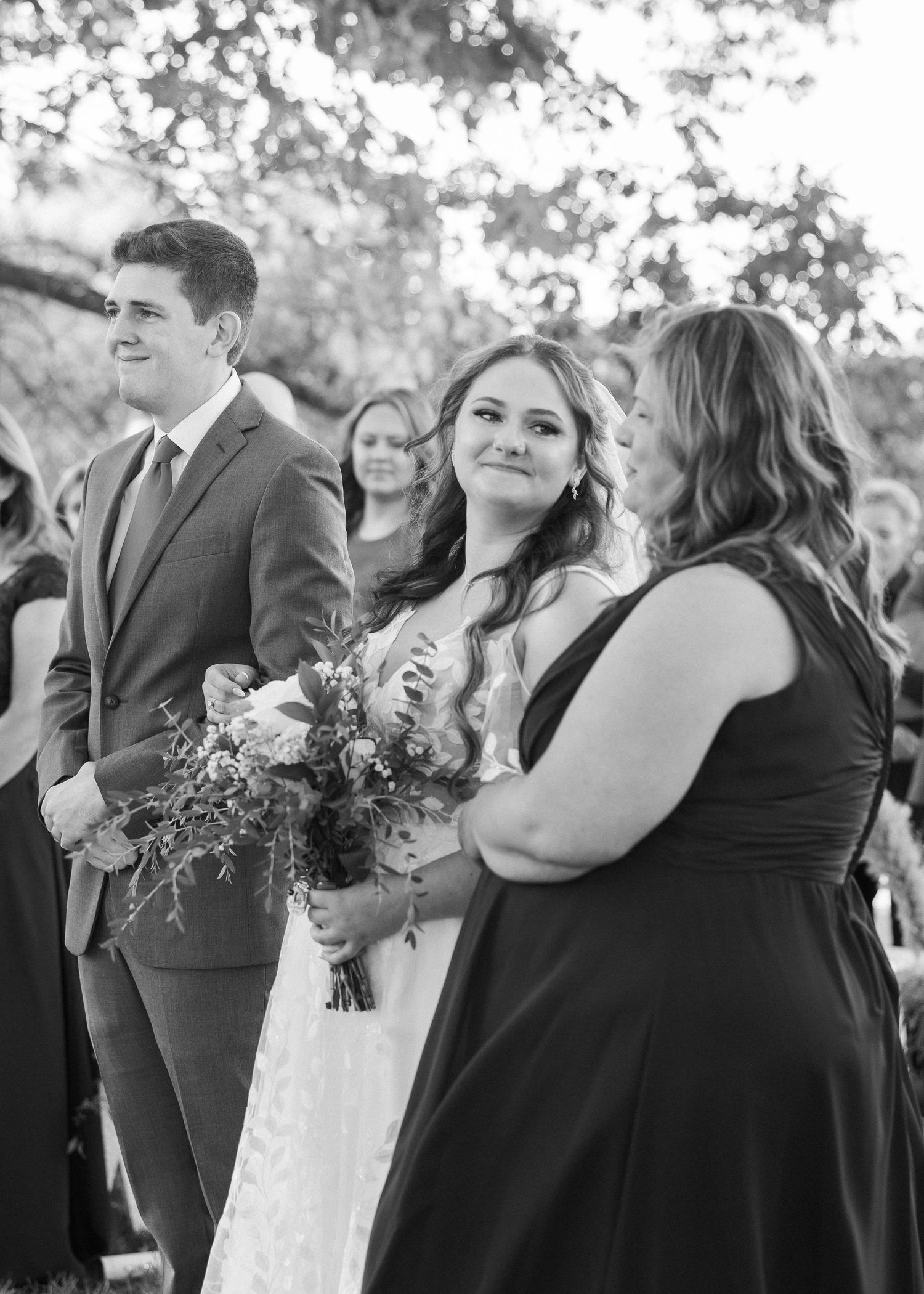 Black and white wedding party candid shots showing joyful moments and laughter.