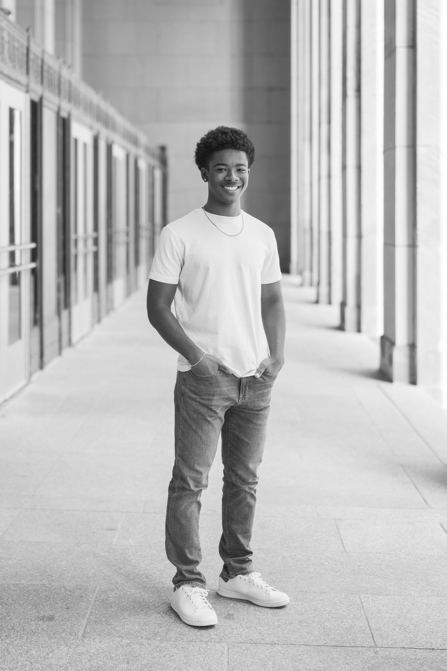 Black and white photo sequence showing someone walking along a bright hallway wearing casual attire.