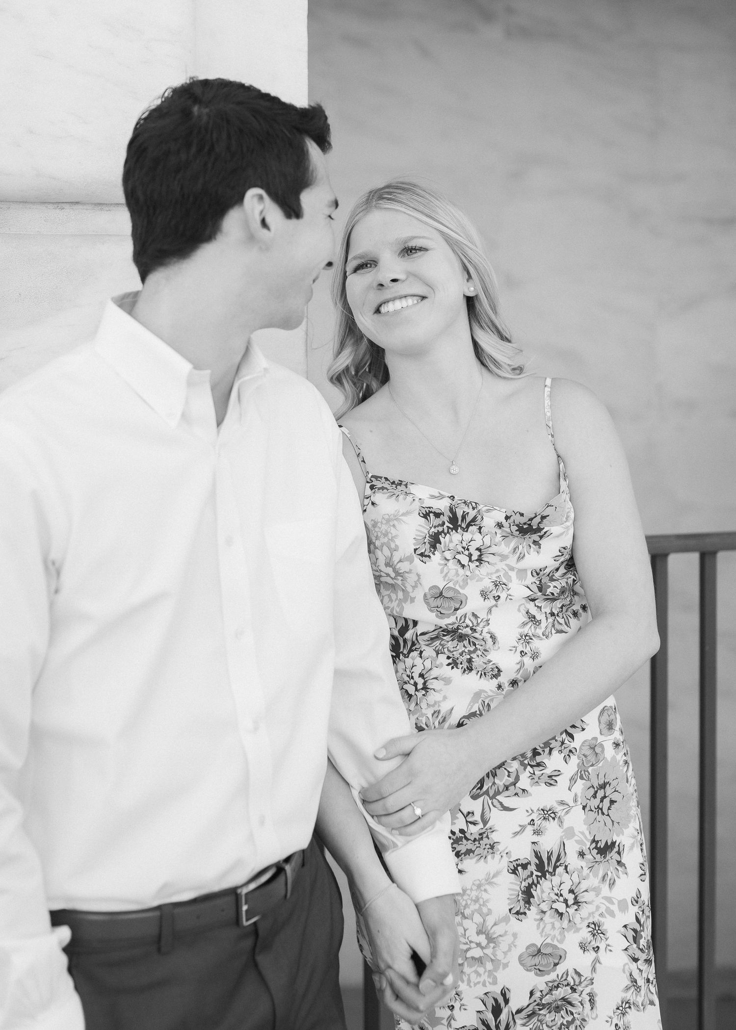 A romantic black and white portrait of a couple sharing a tender moment together.