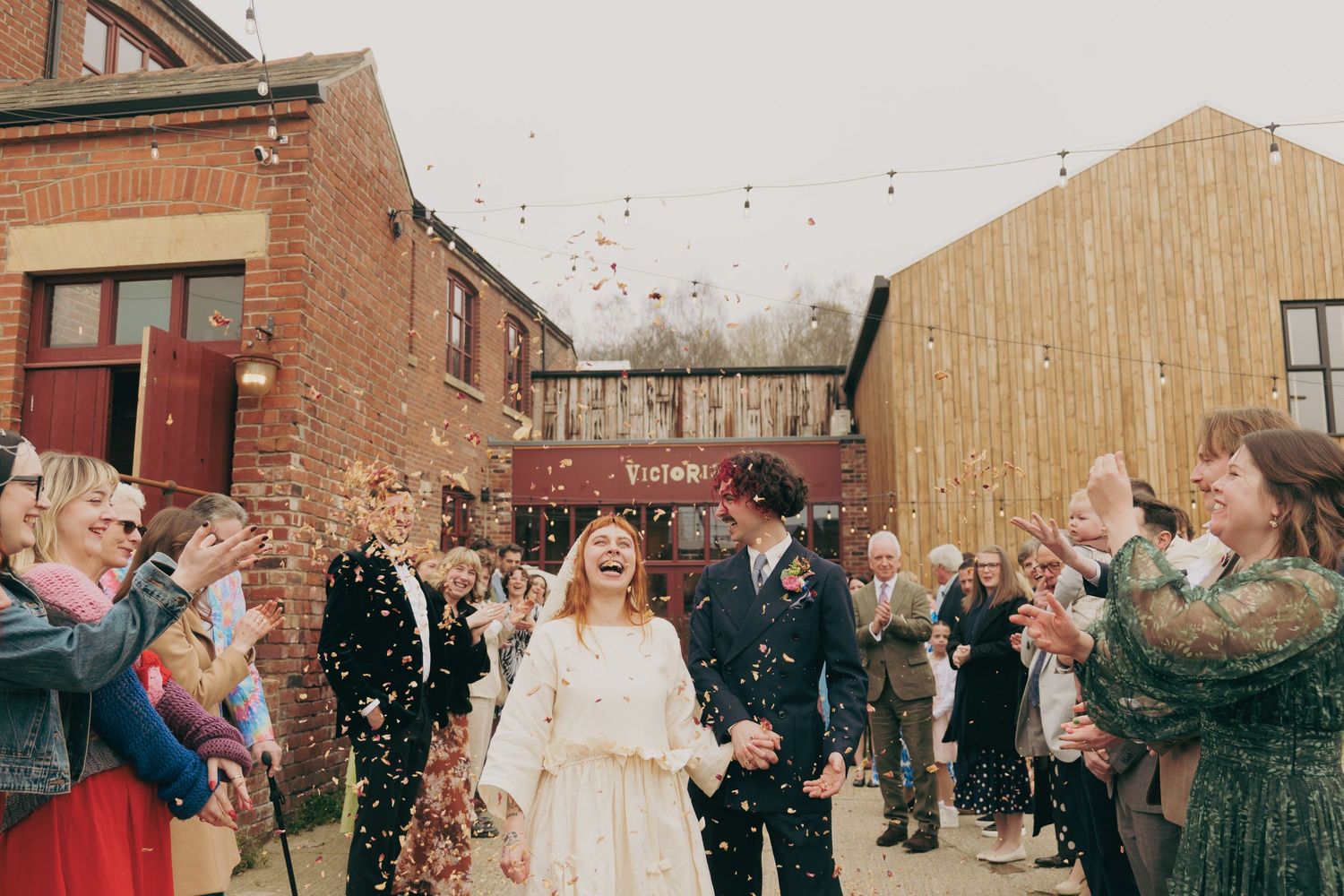Couple with confetti at their wedding