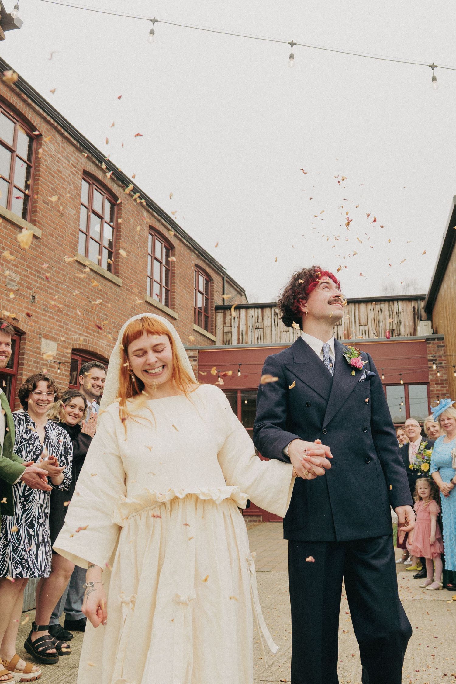 Couple with confetti at their wedding