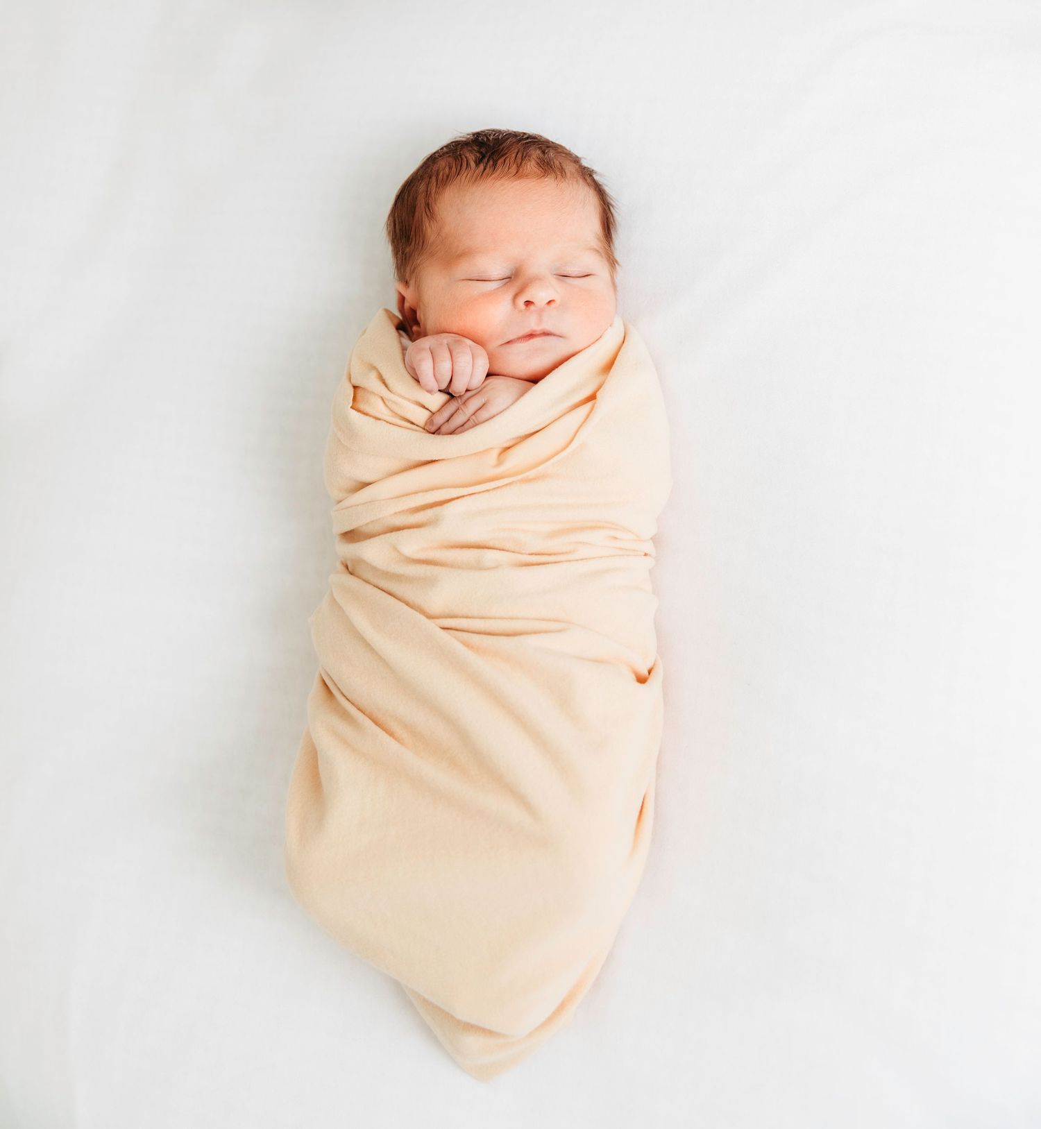 Natural newborn photography in Vaud, Switzerland. Soft, timeless portraits captured in your home