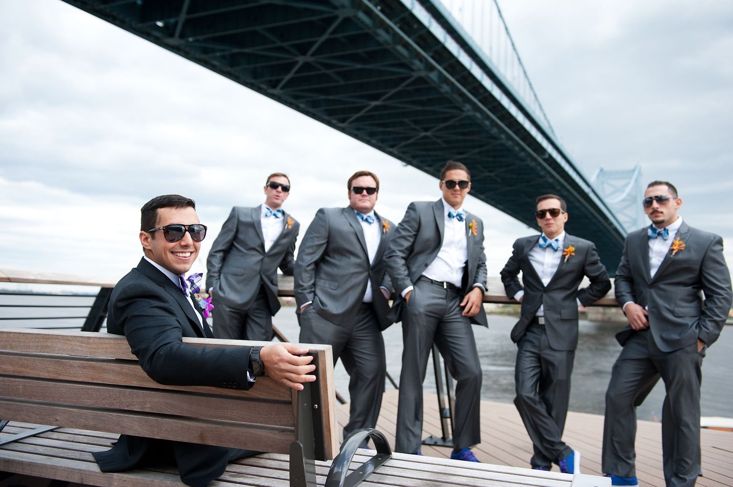 Groomsmen on wedding day at the race street peer in Old City Philadelphia
