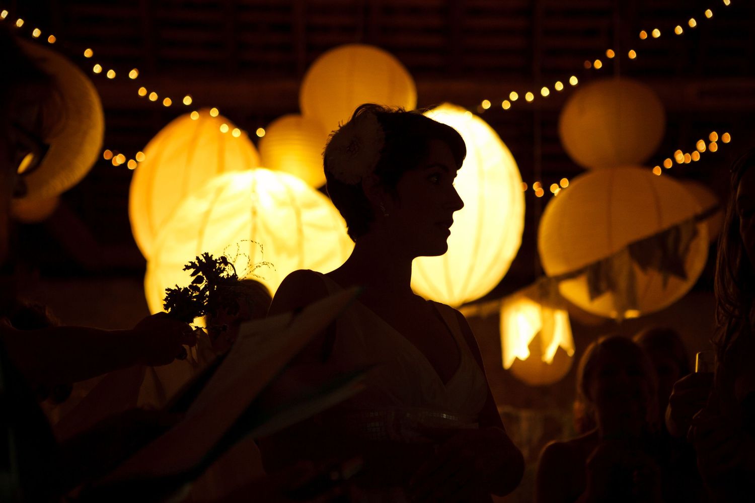 Silhouette of bride with Chinese lanterns