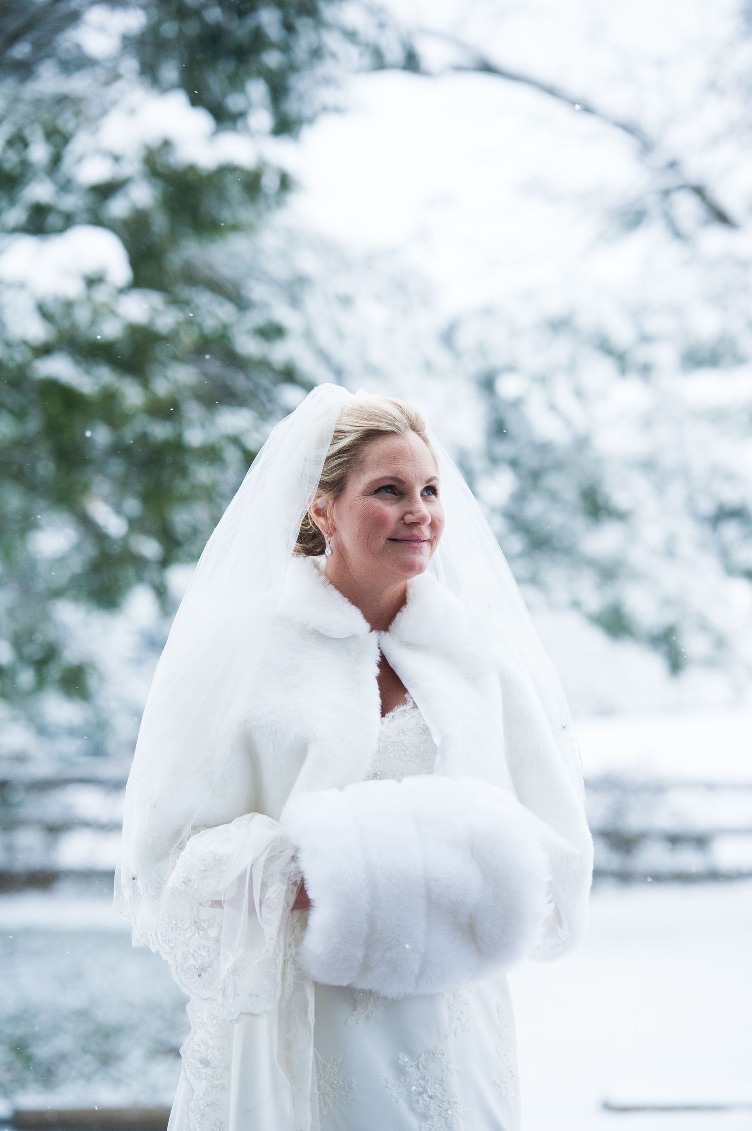 Winter bride in the snow on her wedding day.