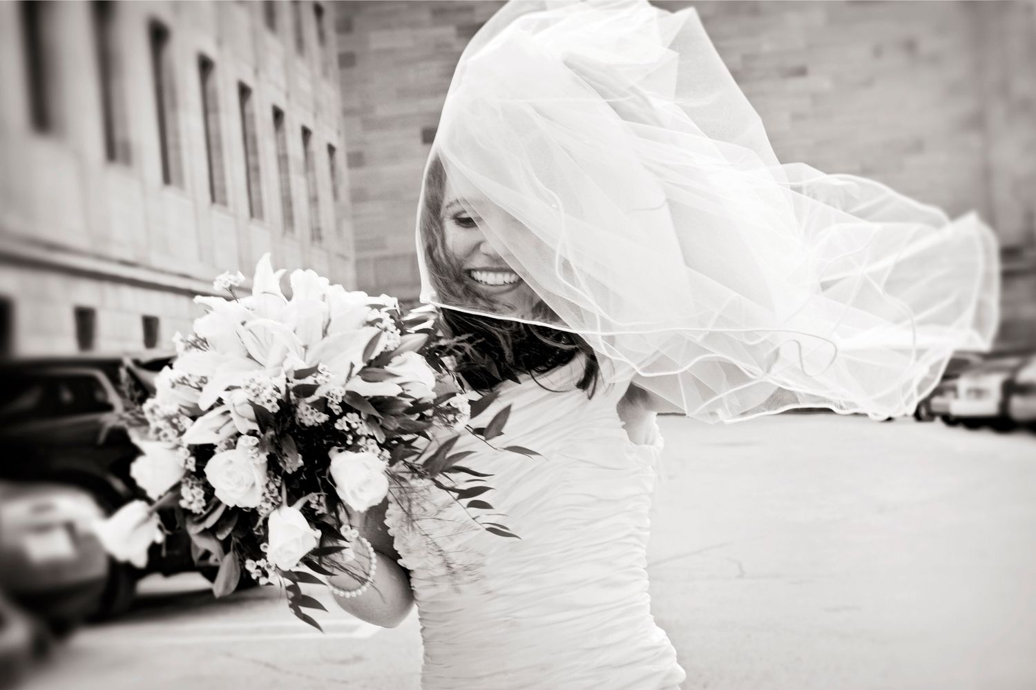 Happy bride in black and white on her wedding day