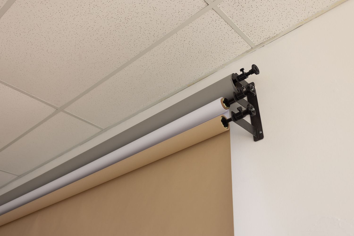 A series of security cameras mounted on white ceilings in an indoor commercial or office space.