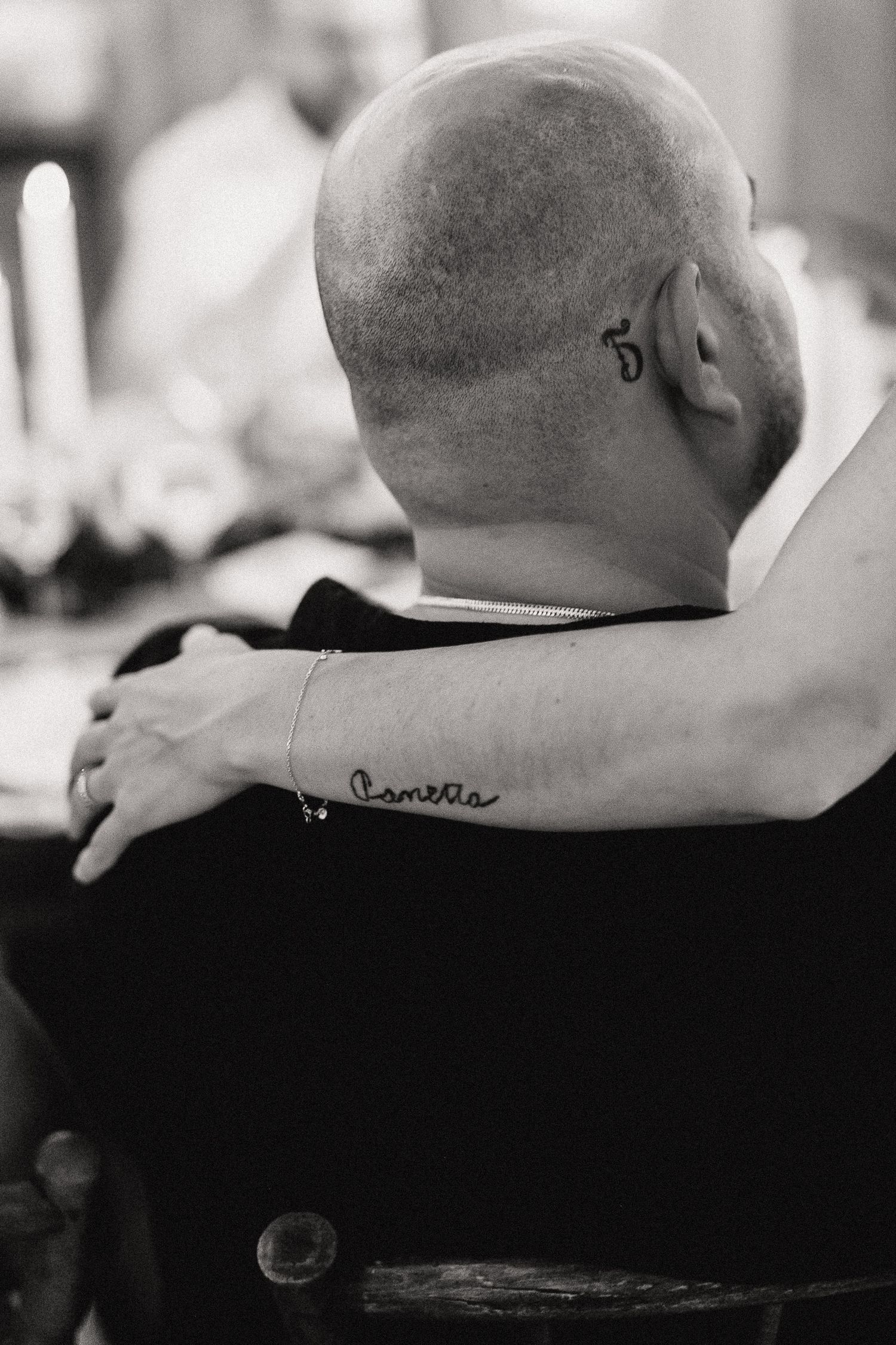 Black and white photo showing two tattoos.