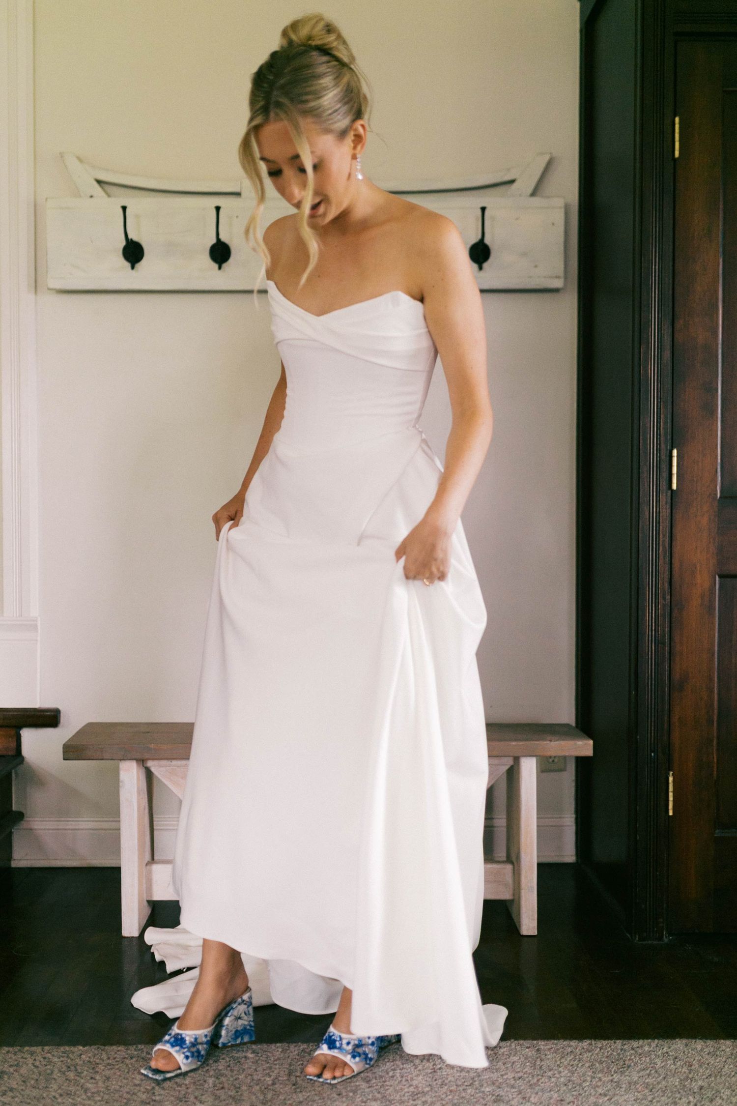 A bride in a white dress lifts their hem to reveal bright blue shoes underneath in a series of playful poses.