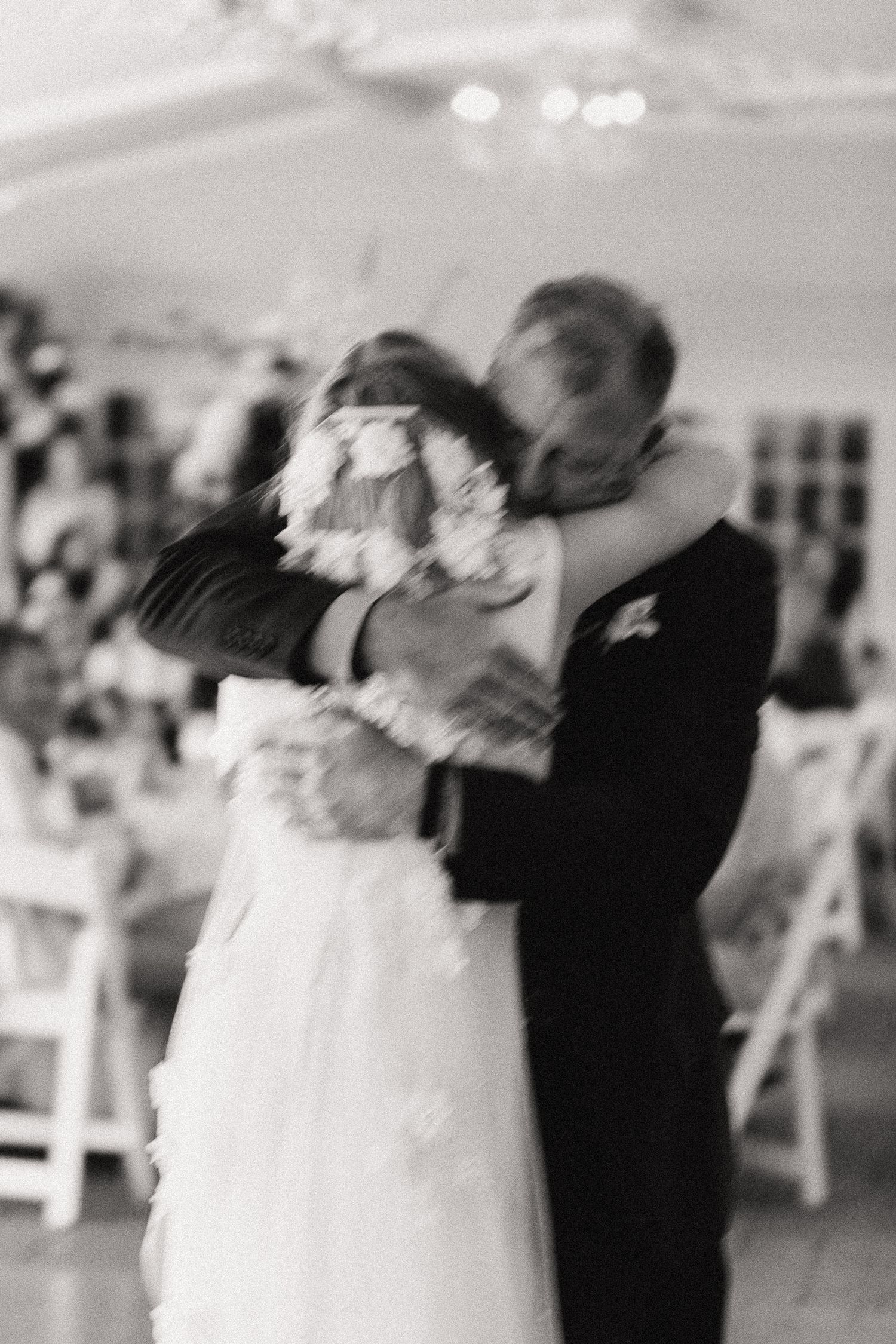 Wedding reception dancing captured in an elegant motion blur sequence.