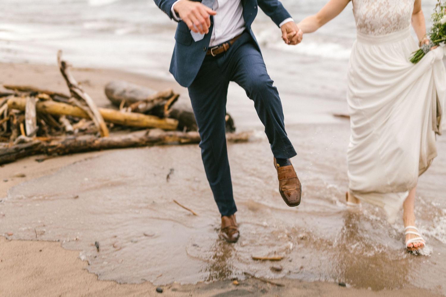 candid documentary photo of bride and groom at an intimate, DIY beach wedding in Michigan