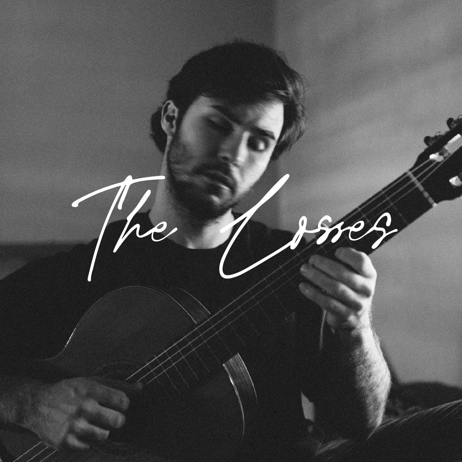 Black and white album cover showing a bearded man playing guitar with The Losses text.