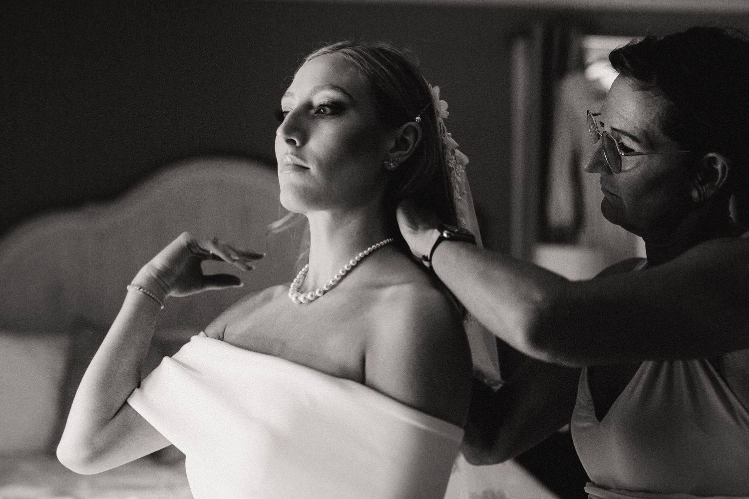 Elegant black and white portrait showing preparations for a formal event.