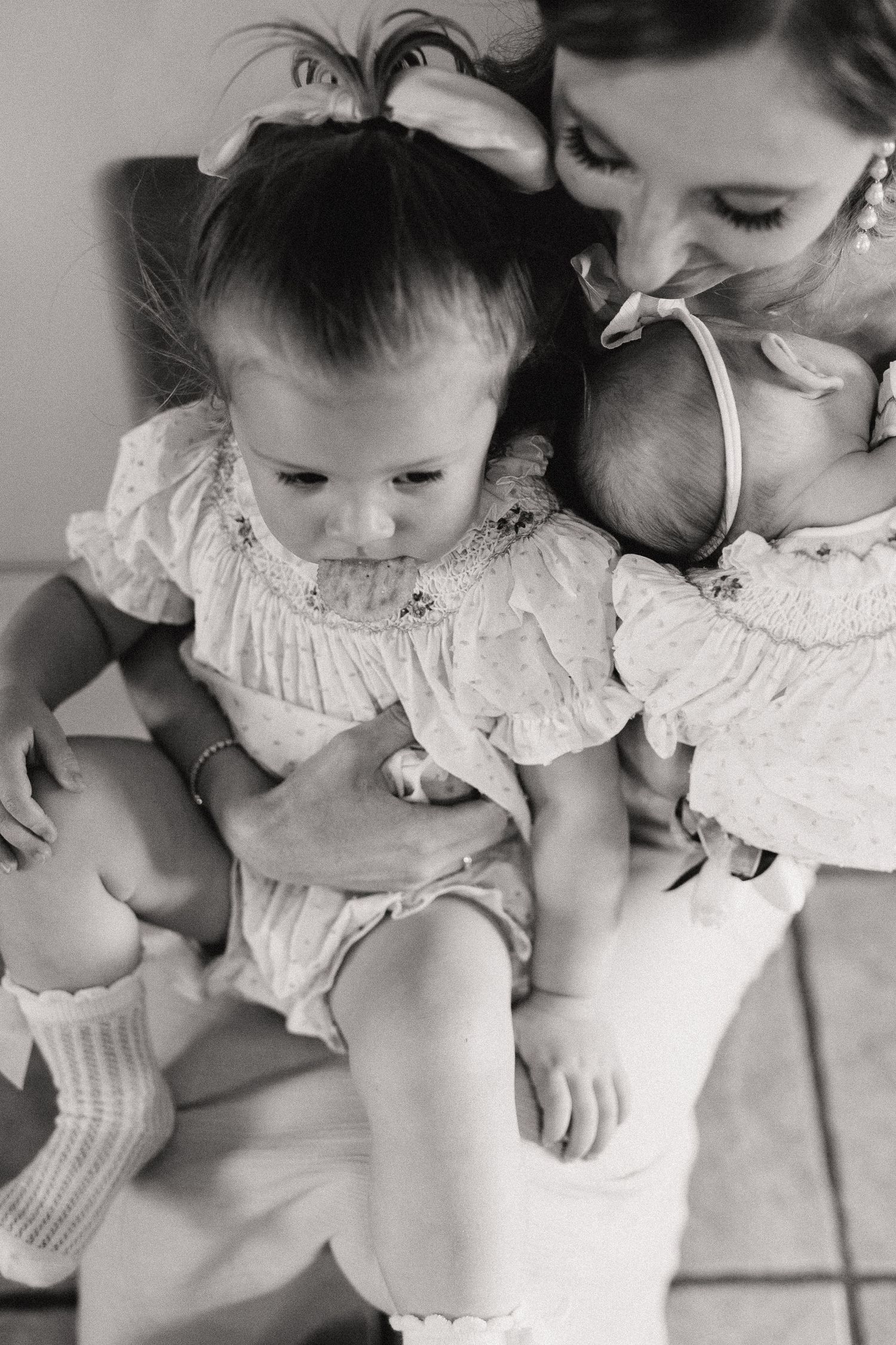 Sweet black and white portrait series showing gentle embraces in delicate white clothing.