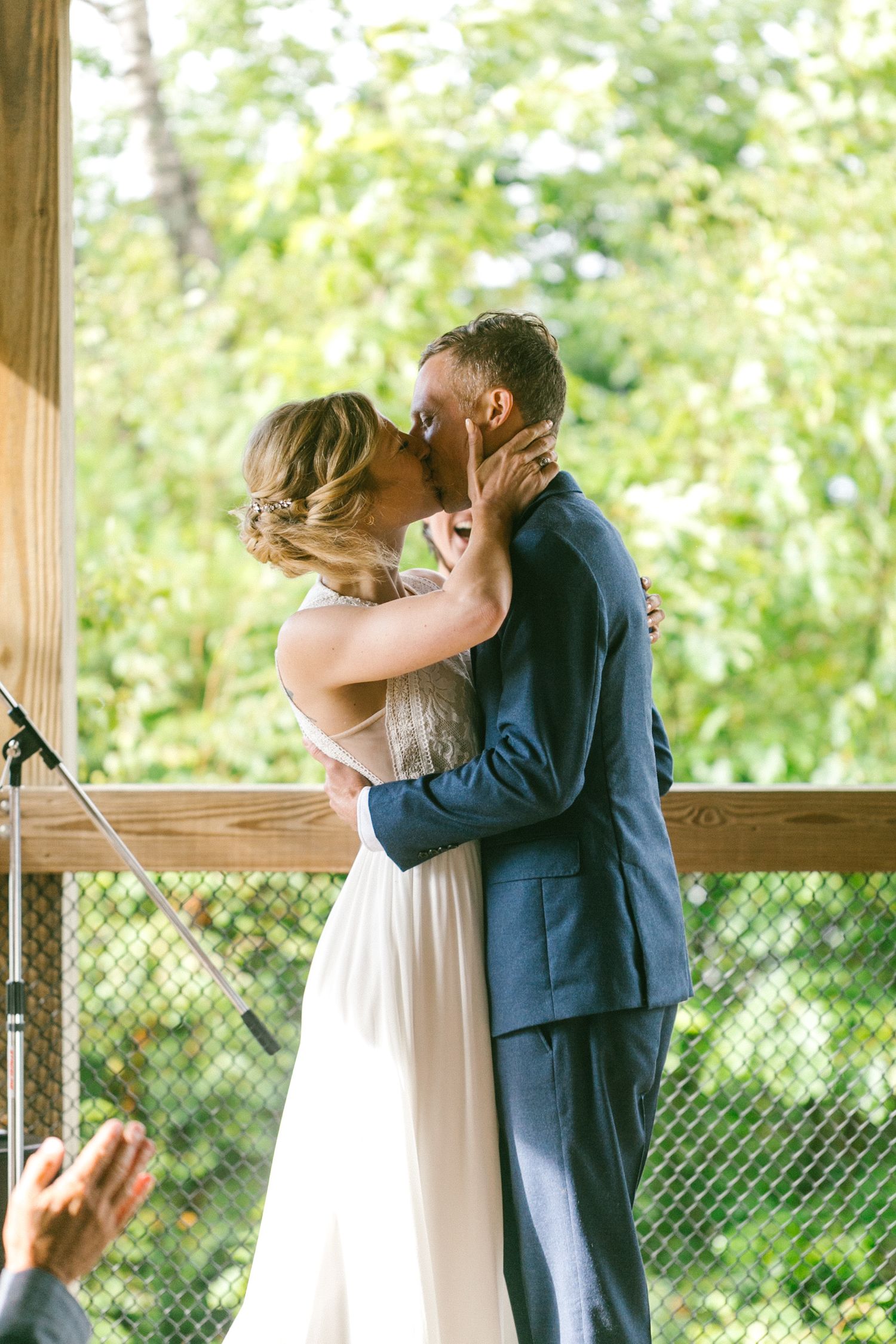 bride and groom first kiss intimate michigan beach wedding, upper michigan.