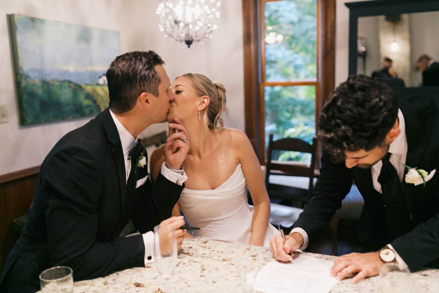 A sequence of five romantic wedding photos showing tender moments between a couple at their reception.