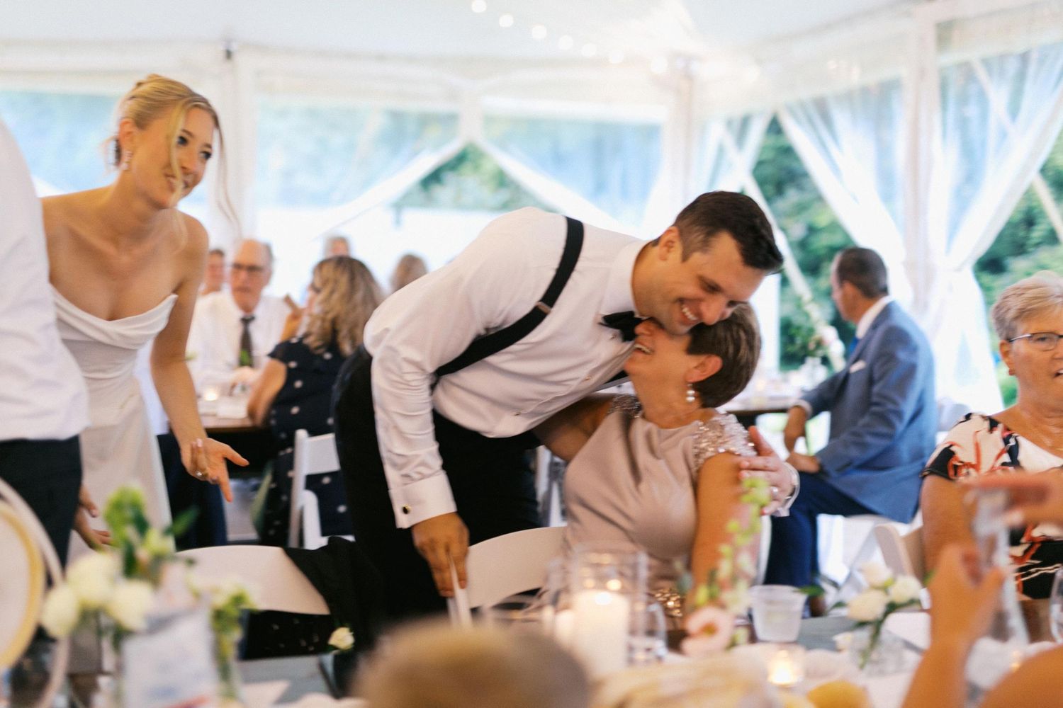 A sequence of wedding reception photos showing dancing, toasting, and celebration moments under a white tent.