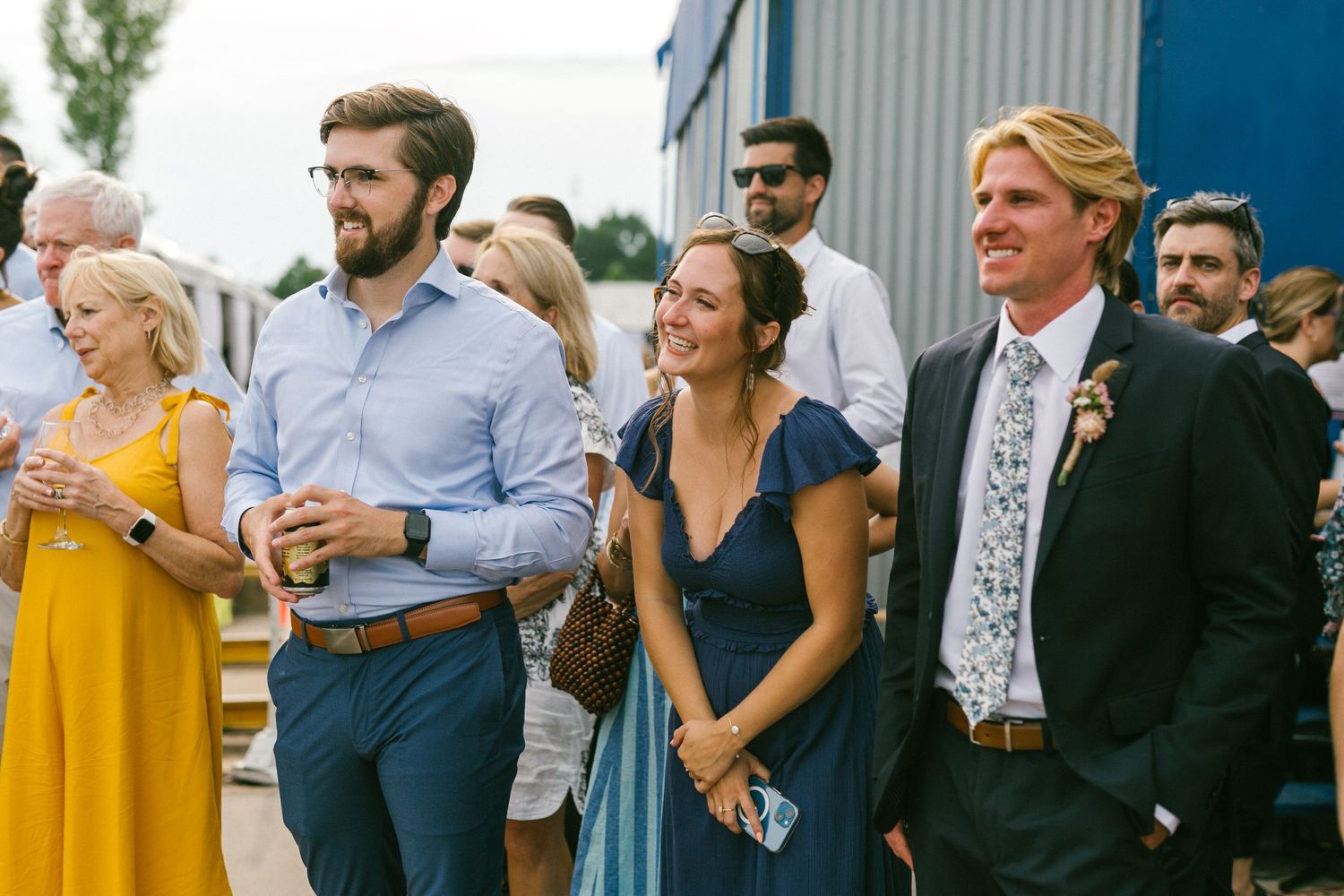 Wedding guests socializing during an outdoor cocktail reception.
