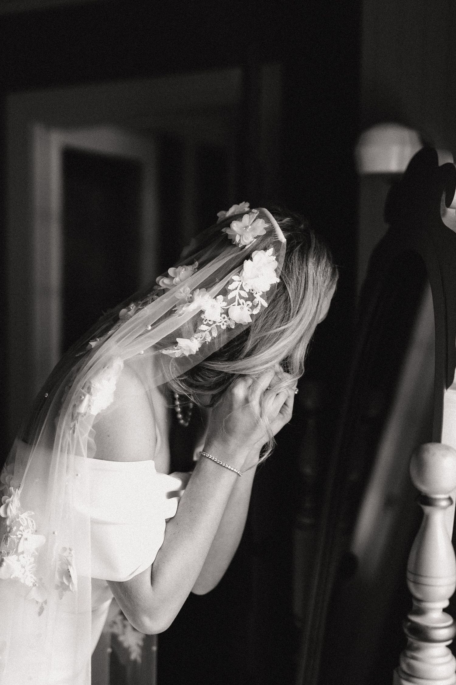 Black and white artistic photos of a bridal veil flowing in sequence.