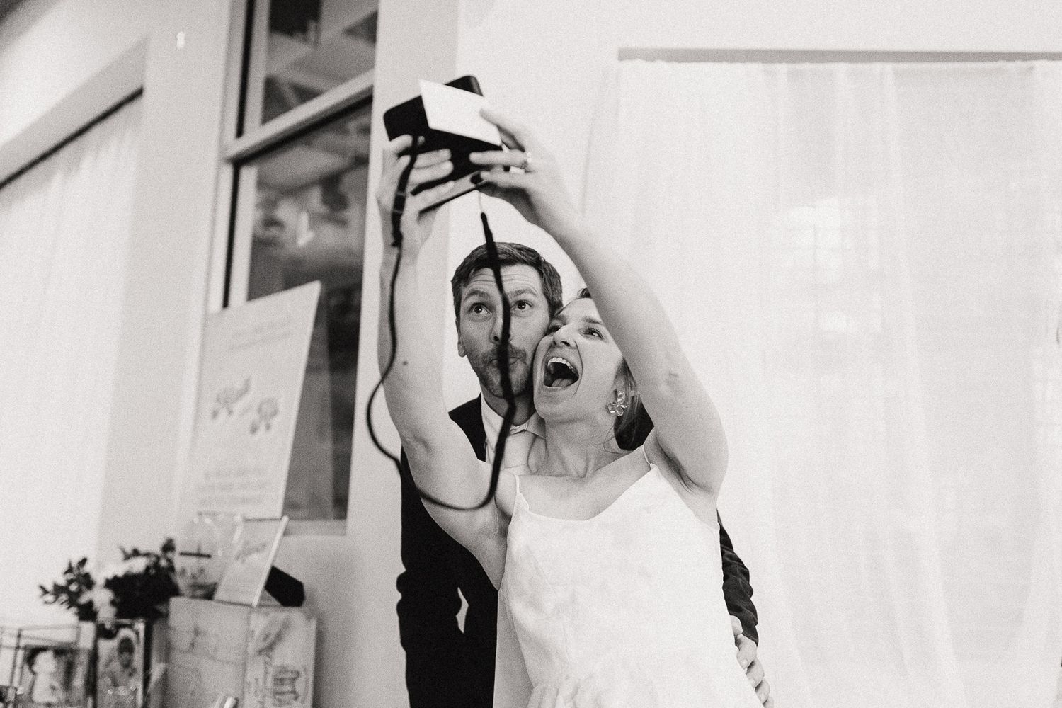 Black and white candid moments captured during wedding preparations.