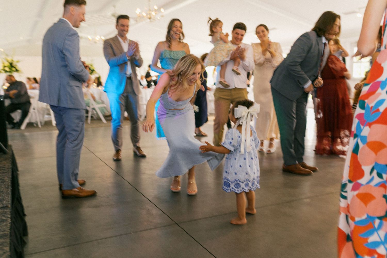 Wedding reception dance floor filled with guests enjoying the celebration.