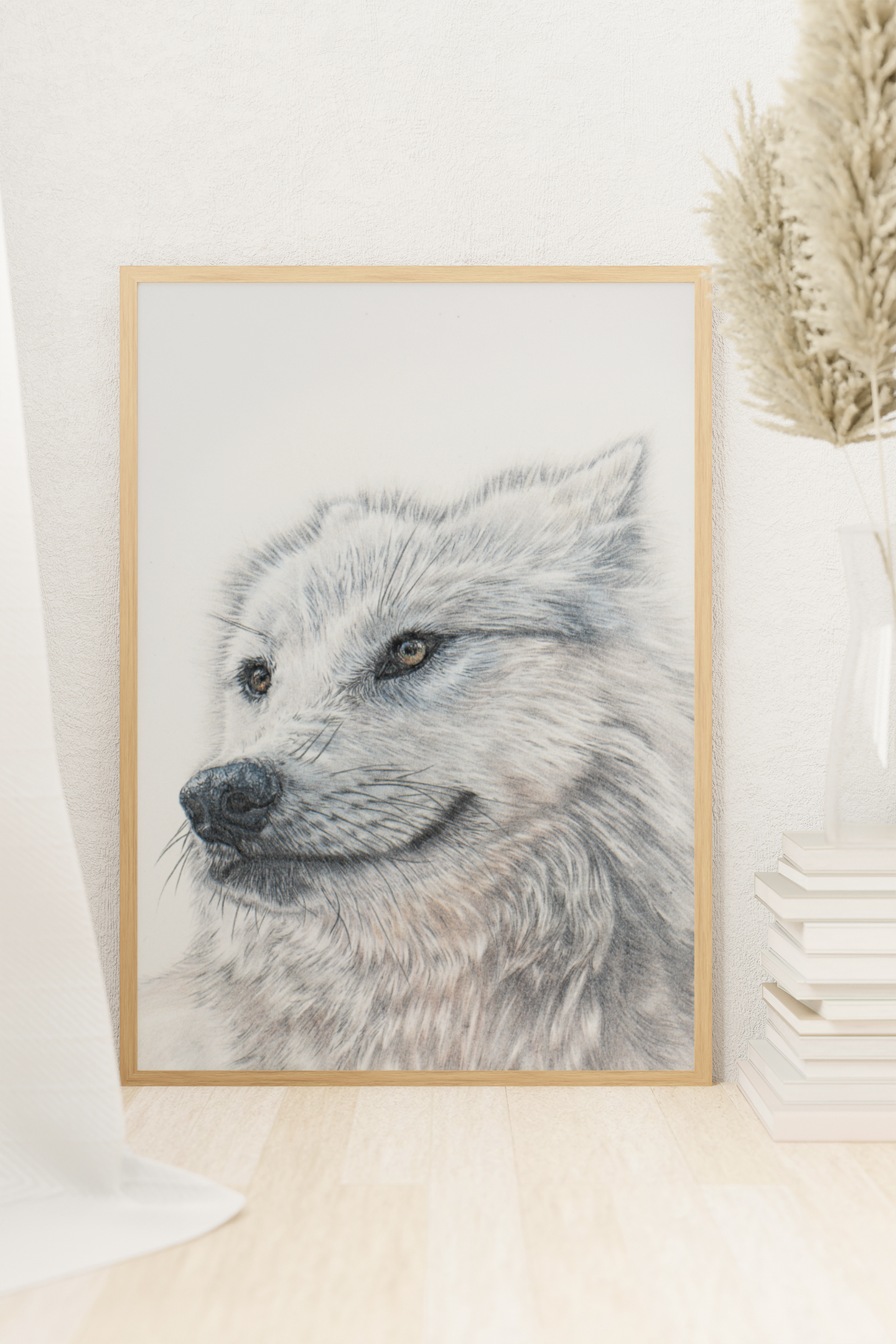 A large print of a white wolf that was originally hand drawn. Sitting against the wall in a wooden frame. Adelaide, South Australia