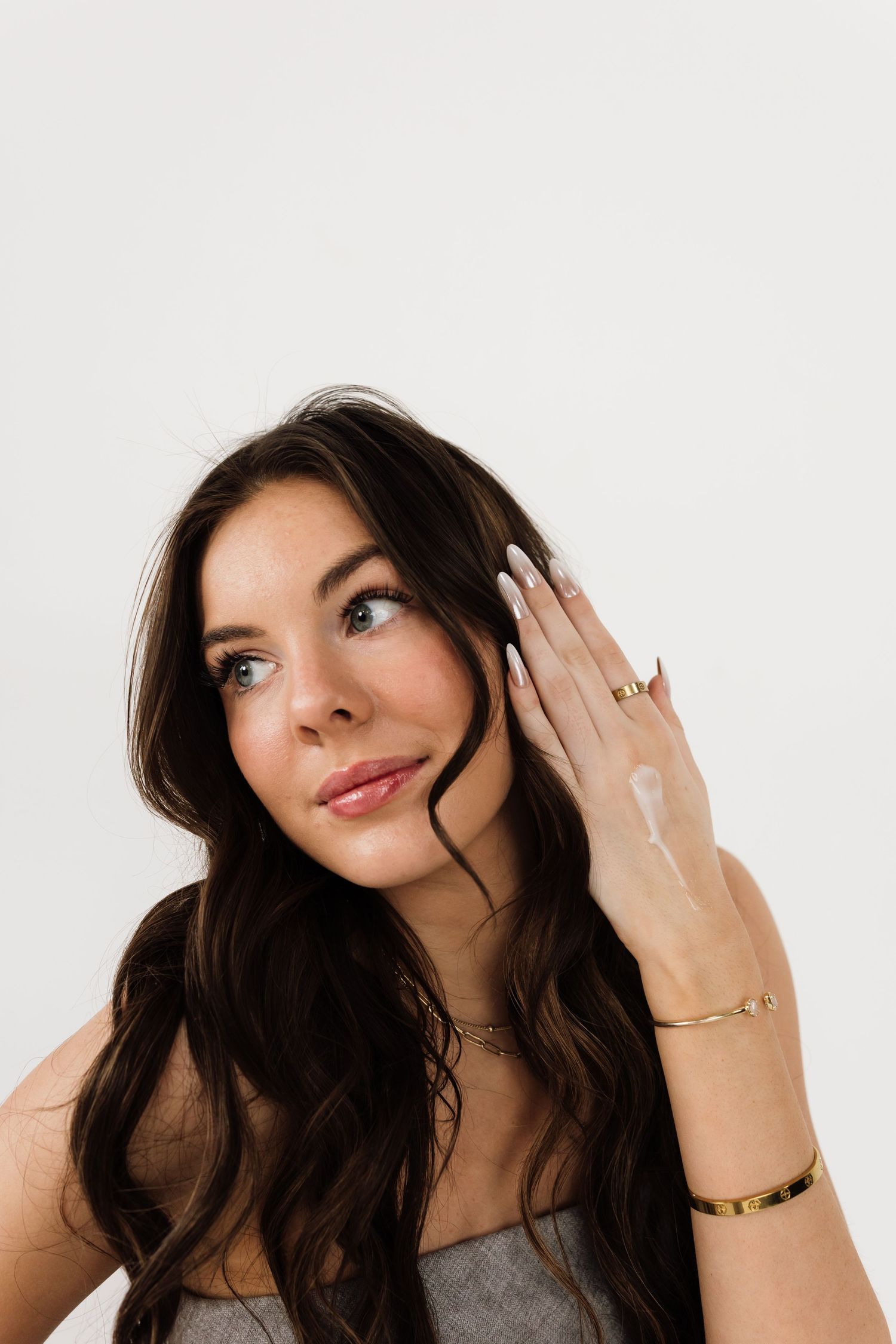 Studio beauty shots showing playful expressions and jewelry accessories.