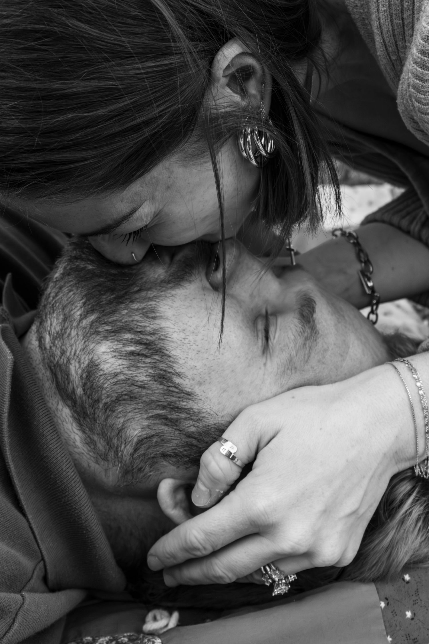 Intimate black and white close-up portrait showing tender emotional connection.