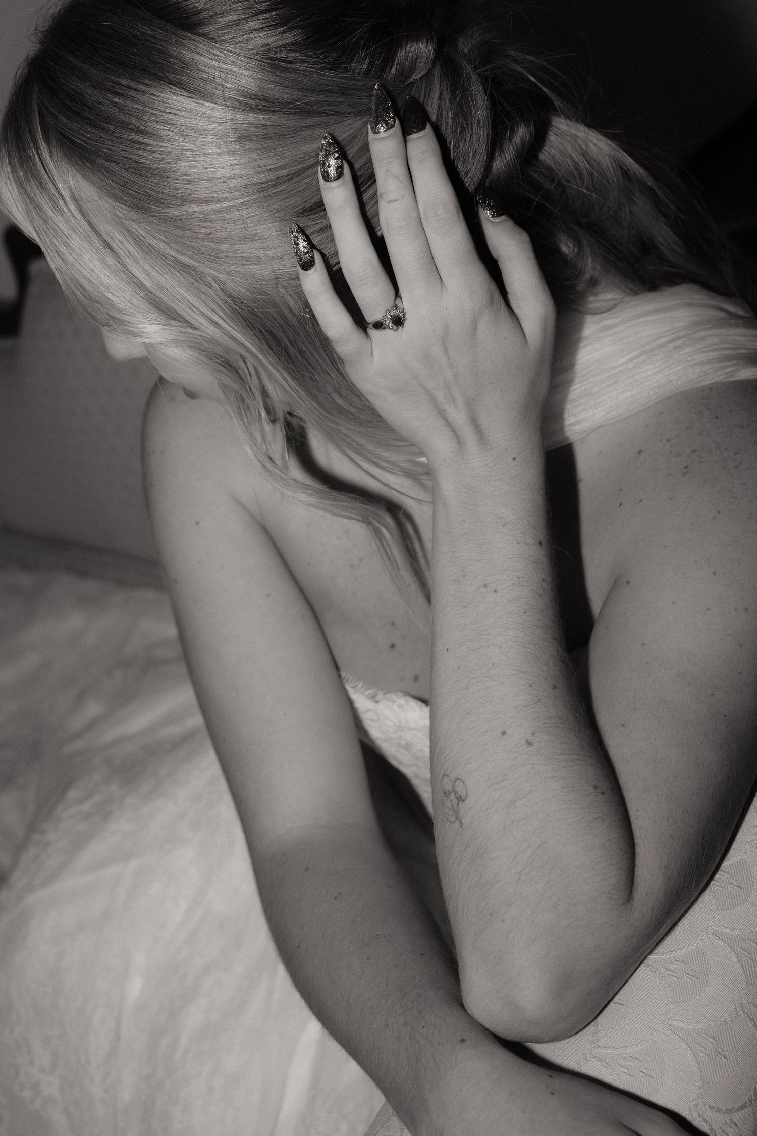 Black and white artistic portrait showing emotional distress and vulnerability.