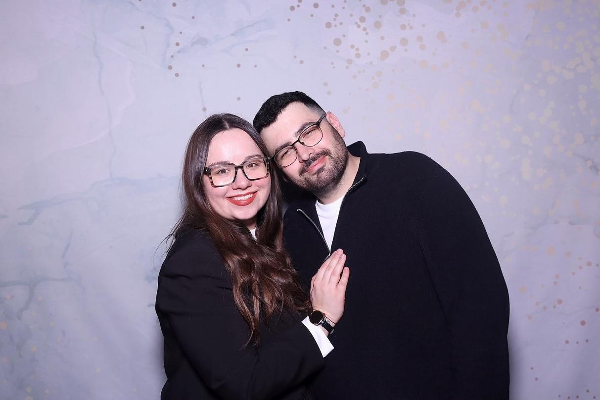 Photo booth portraits of a couple posing together against a light background.