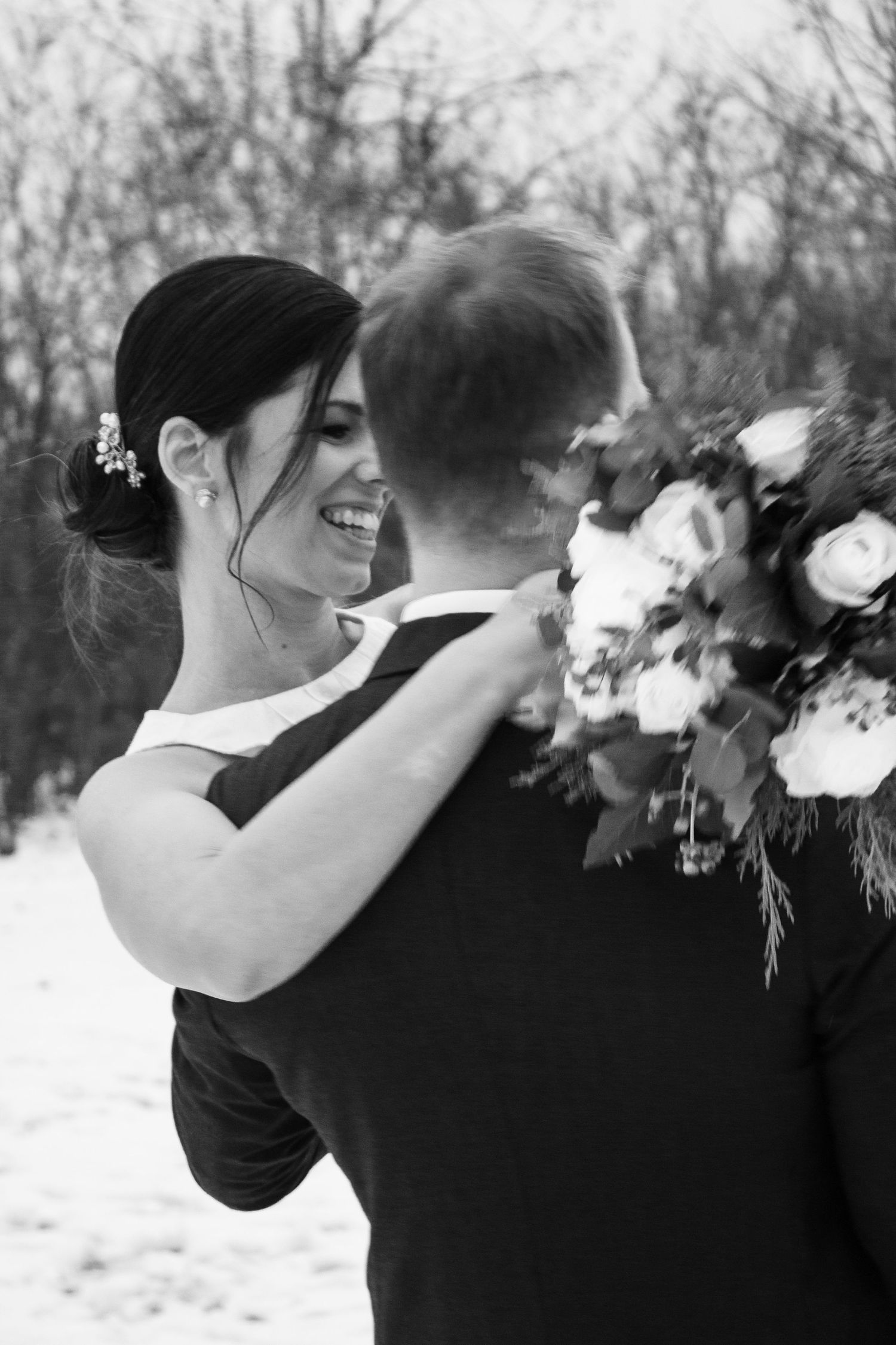 Black and white wedding photo showing intimate moments between a couple with floral details.