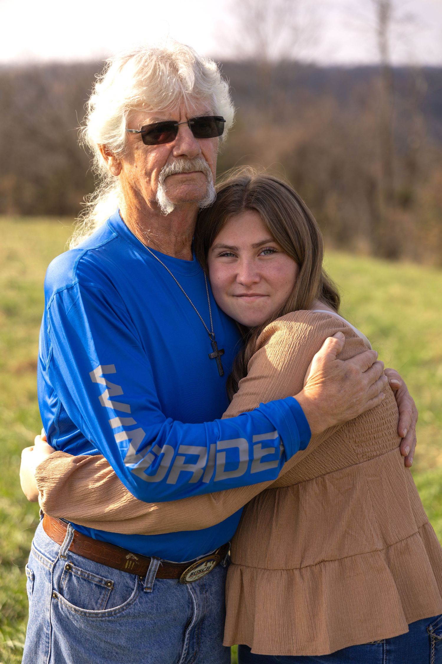 A series of heartwarming embrace photos taken outdoors showing affection and connection in a natural setting.