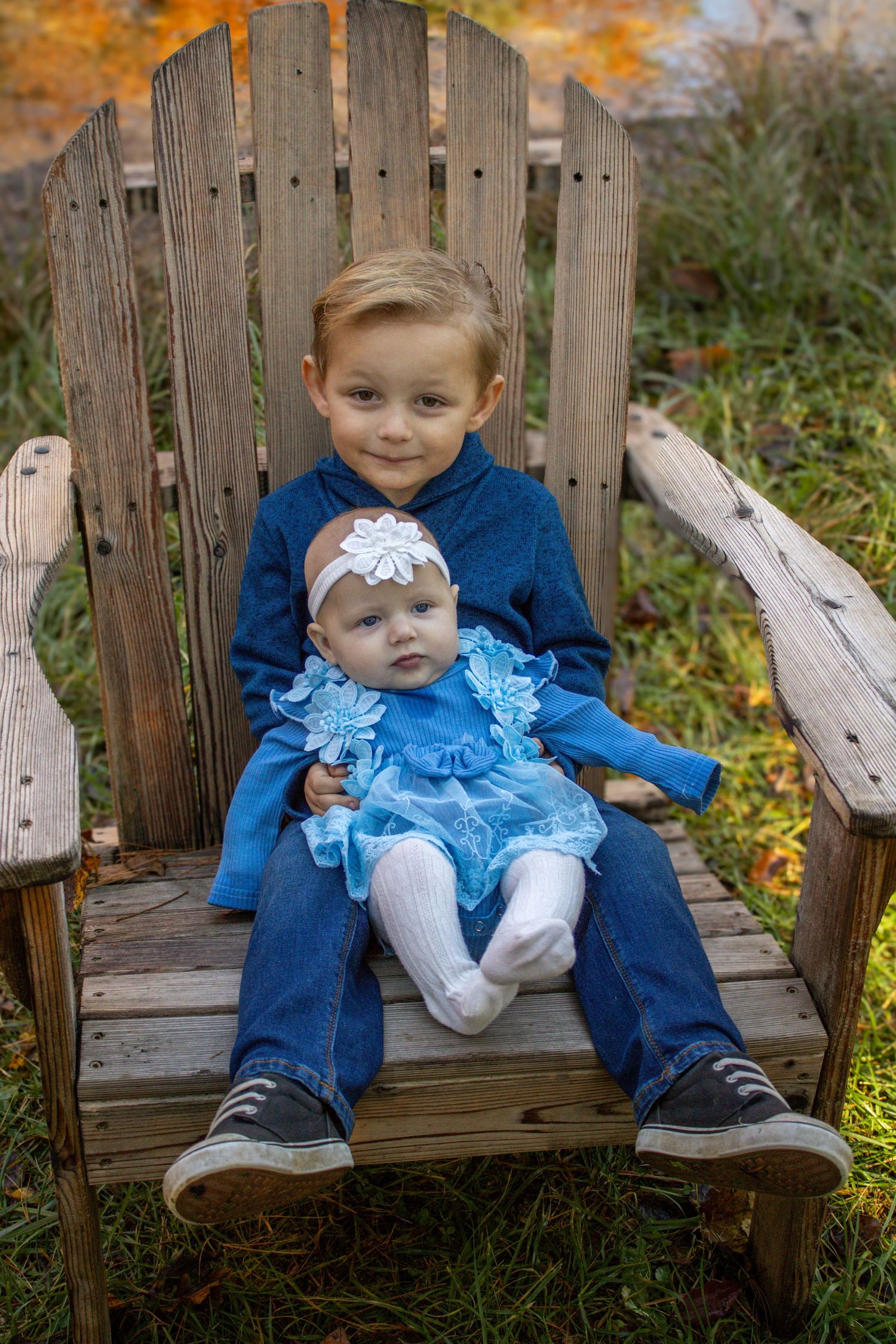 Sequence of photos showing siblings in matching blue outfits sitting on a wooden bench during autumn.