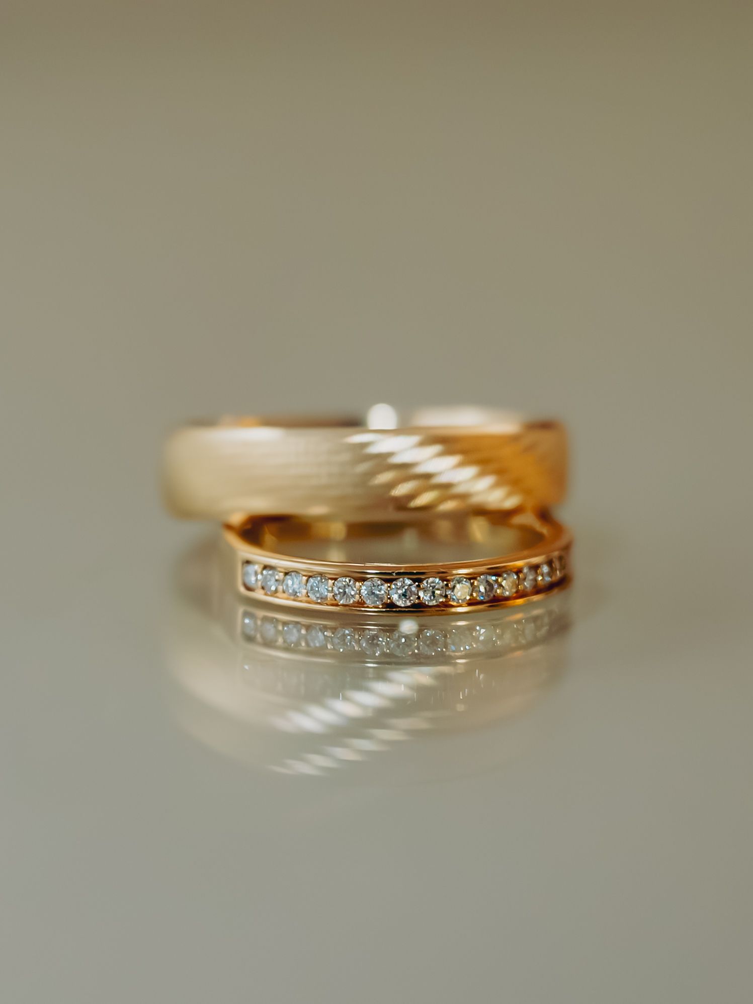 Elegant rose gold wedding band set with diamond eternity ring displayed on a neutral background.