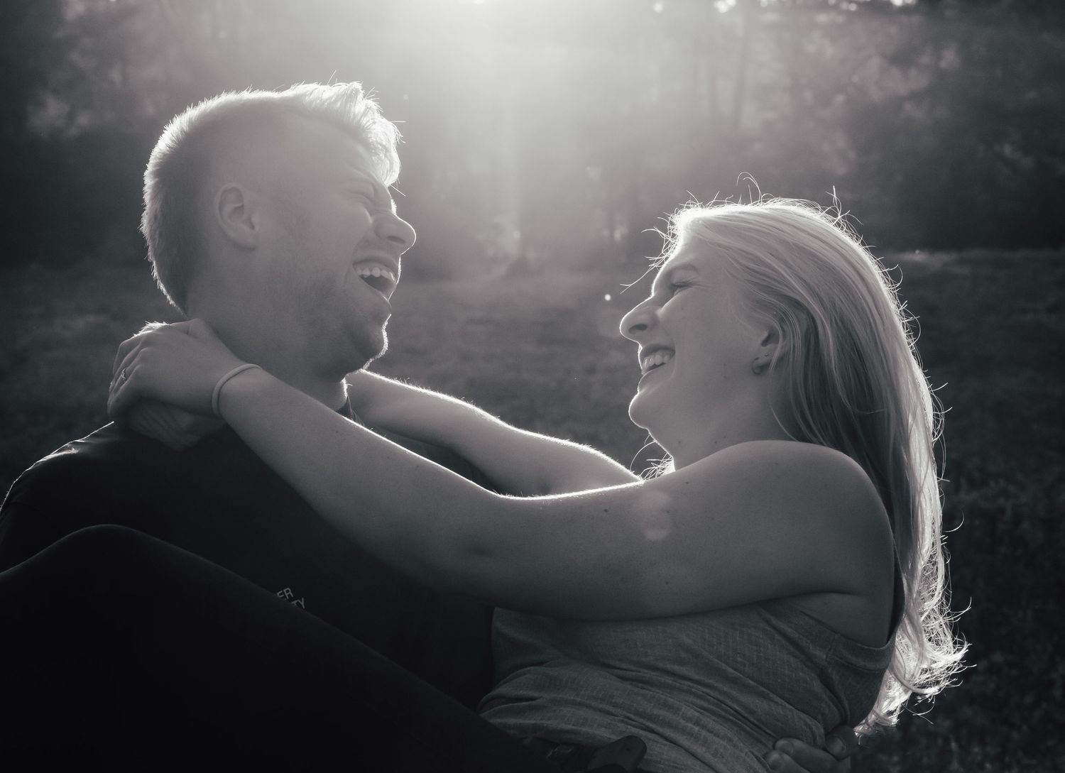 Romantic black and white portraits showing intimate moments and laughter.