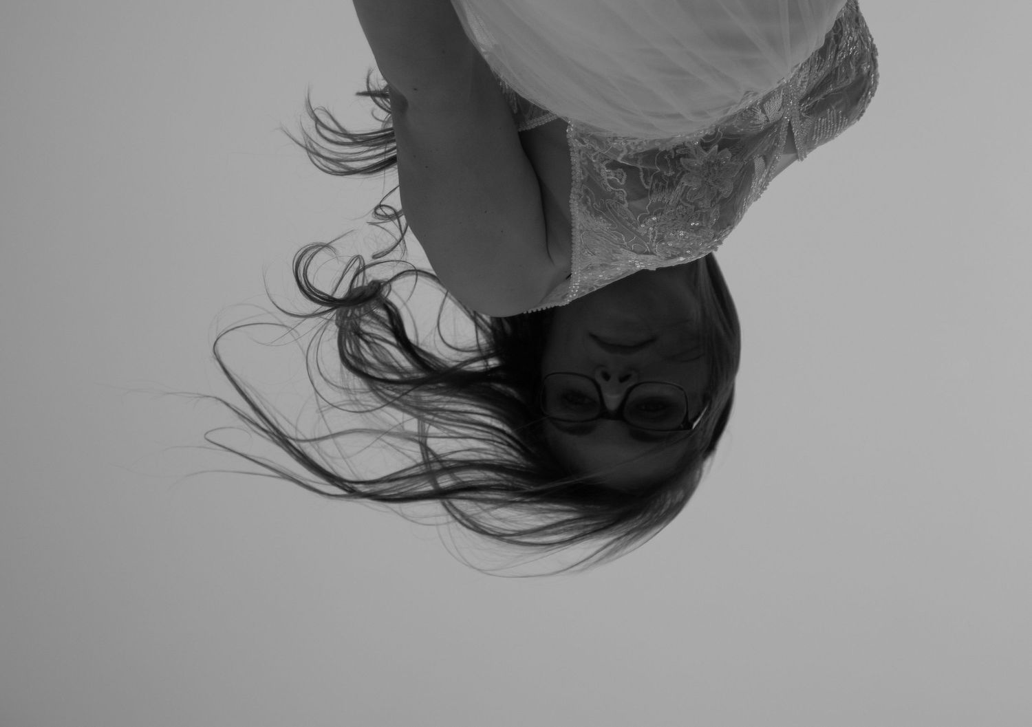 Abstract black and white portrait showing flowing movement and fabric.