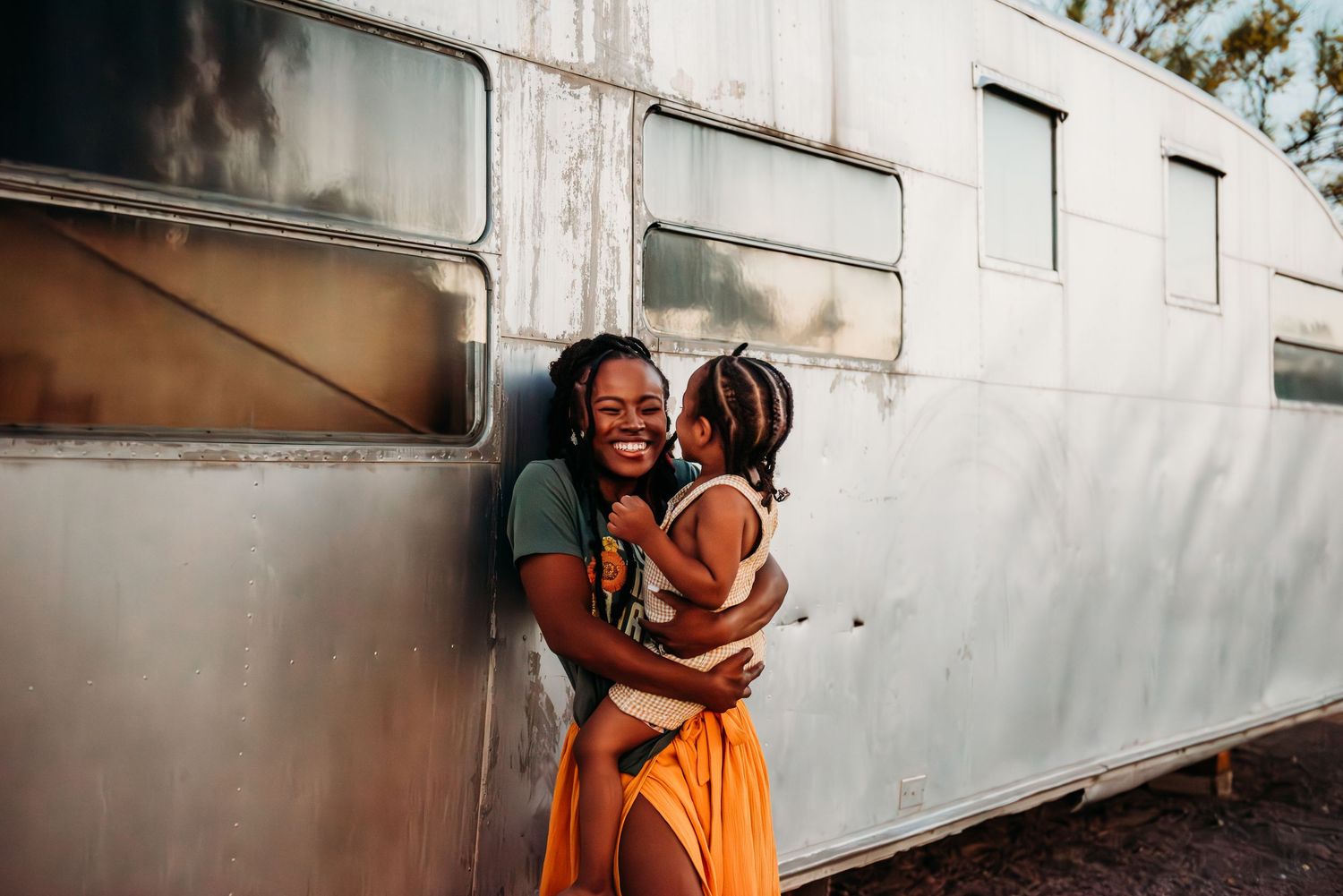Romantic couple photos against vintage train car exterior.
