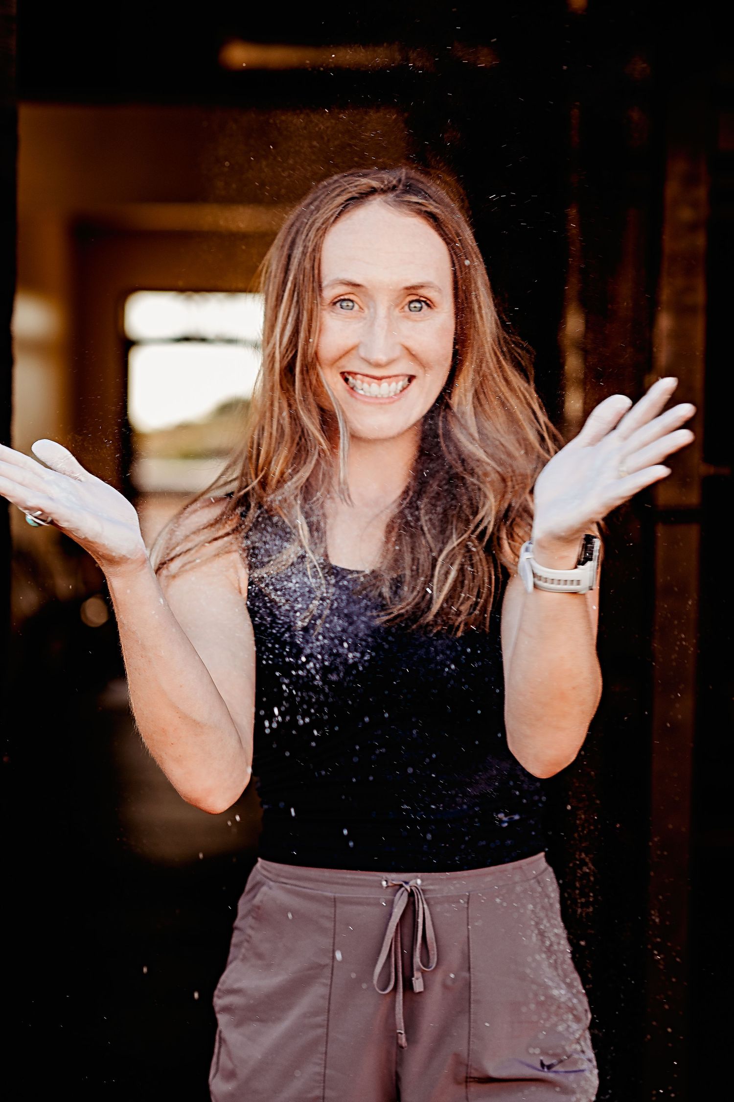 A woman in a sparkly black top and brown pants shows playful expressions in a sequence of five connected photos.