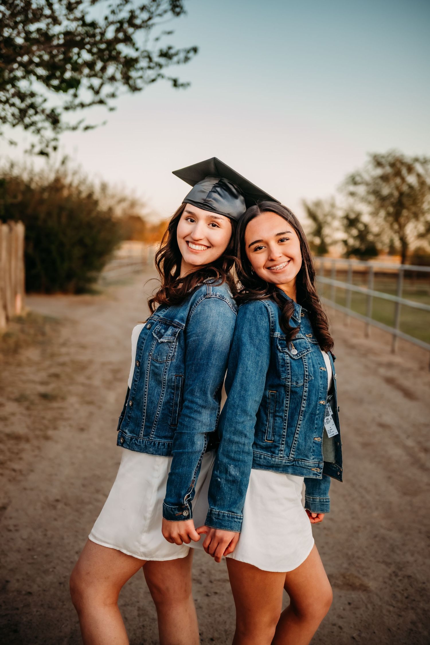 Graduation photo series featuring denim jackets and mortarboard caps on a dirt path.