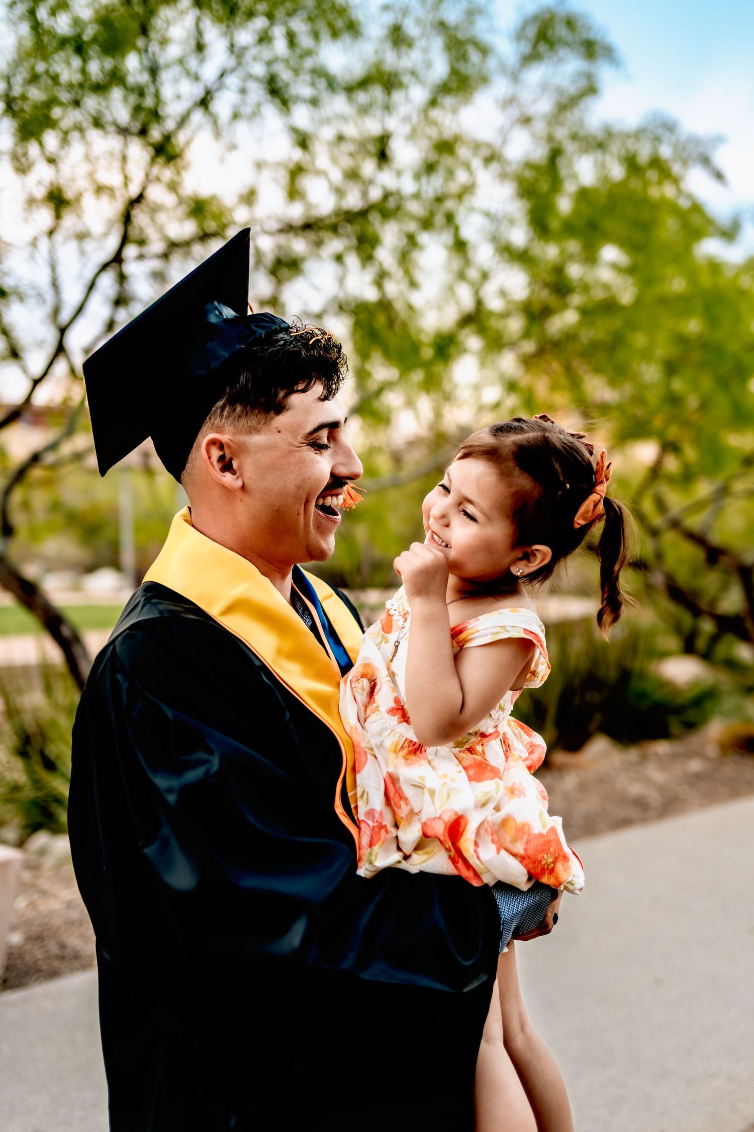 Graduation celebration photos with cap and gown outdoors.