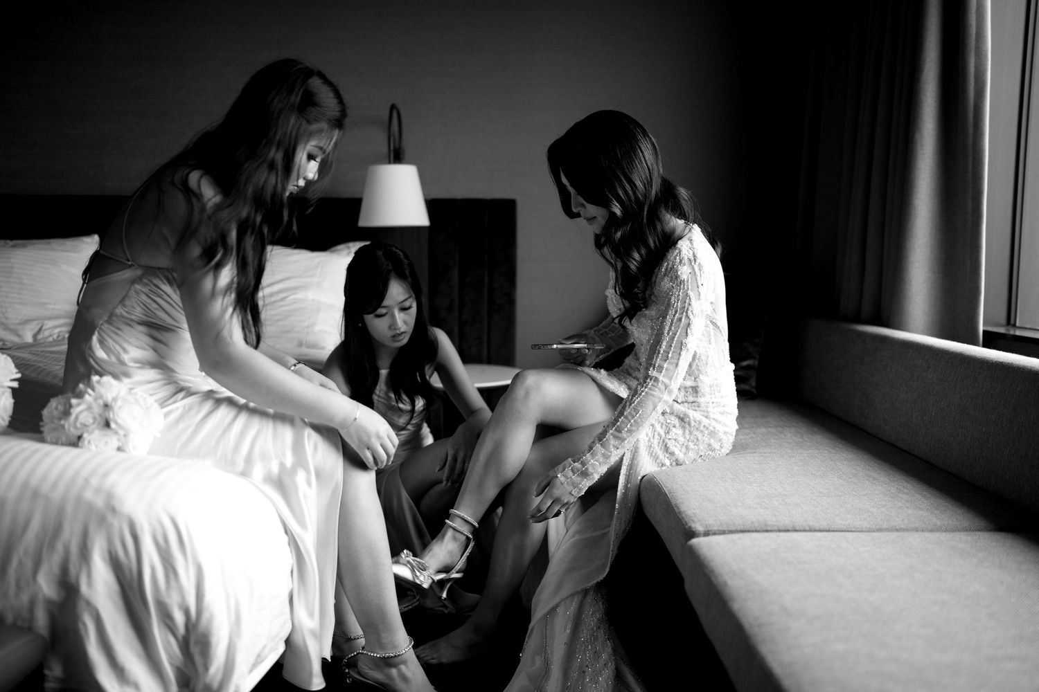 Intimate black and white wedding photography capturing quiet moments in natural light.