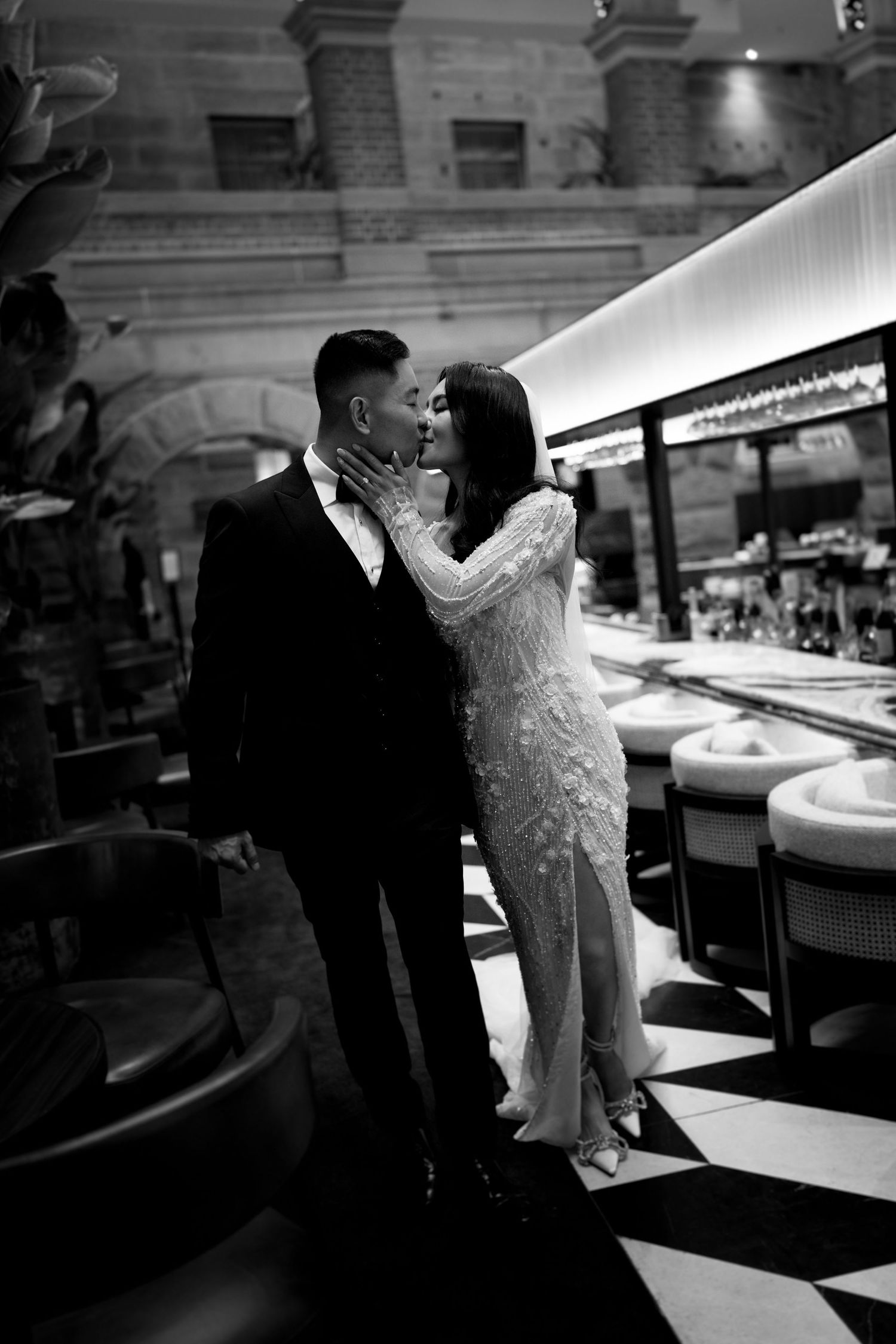 Romantic black and white photos of couple in vintage-style diner setting.