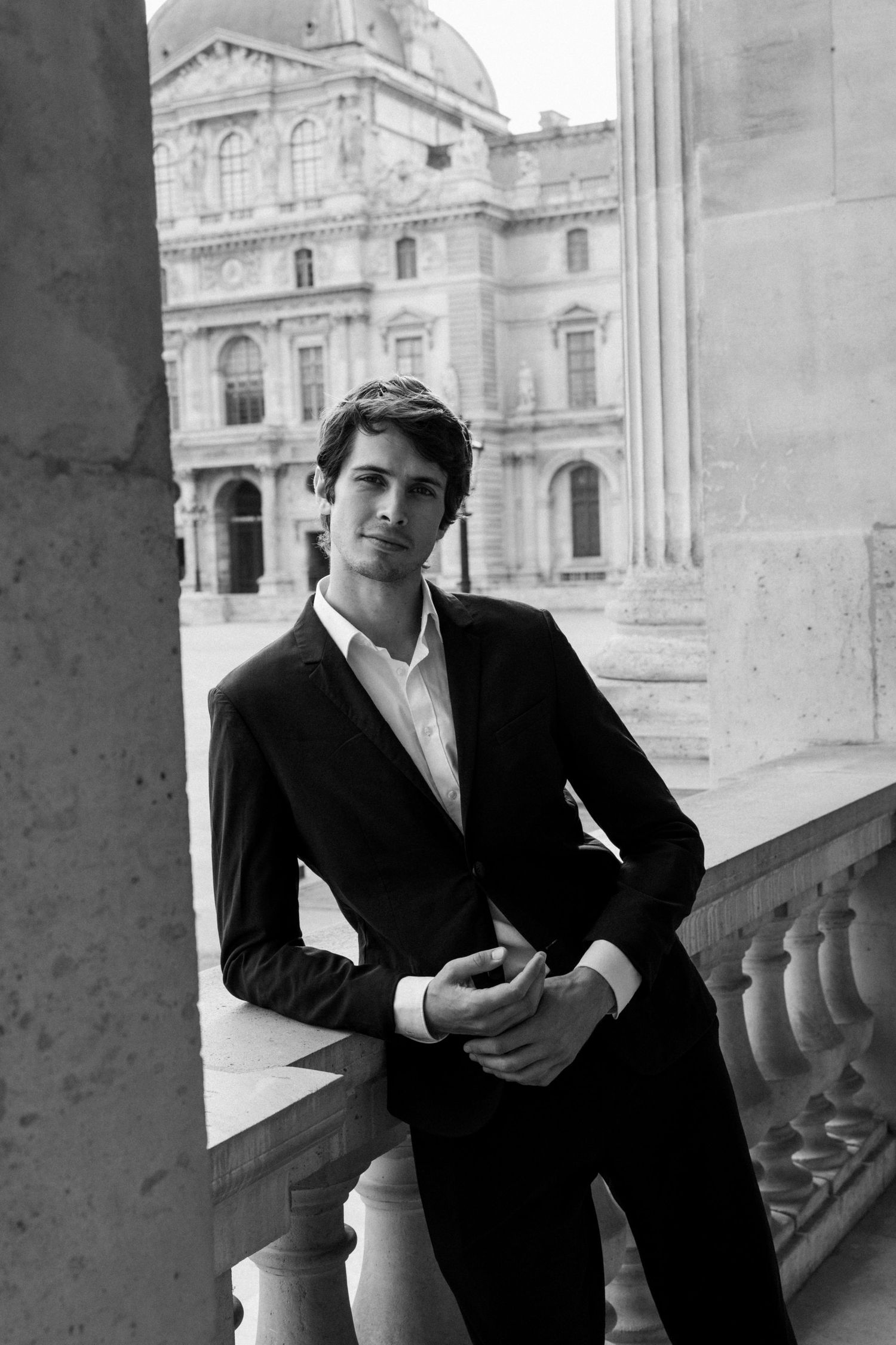 Black and white portrait series in classical architecture setting.