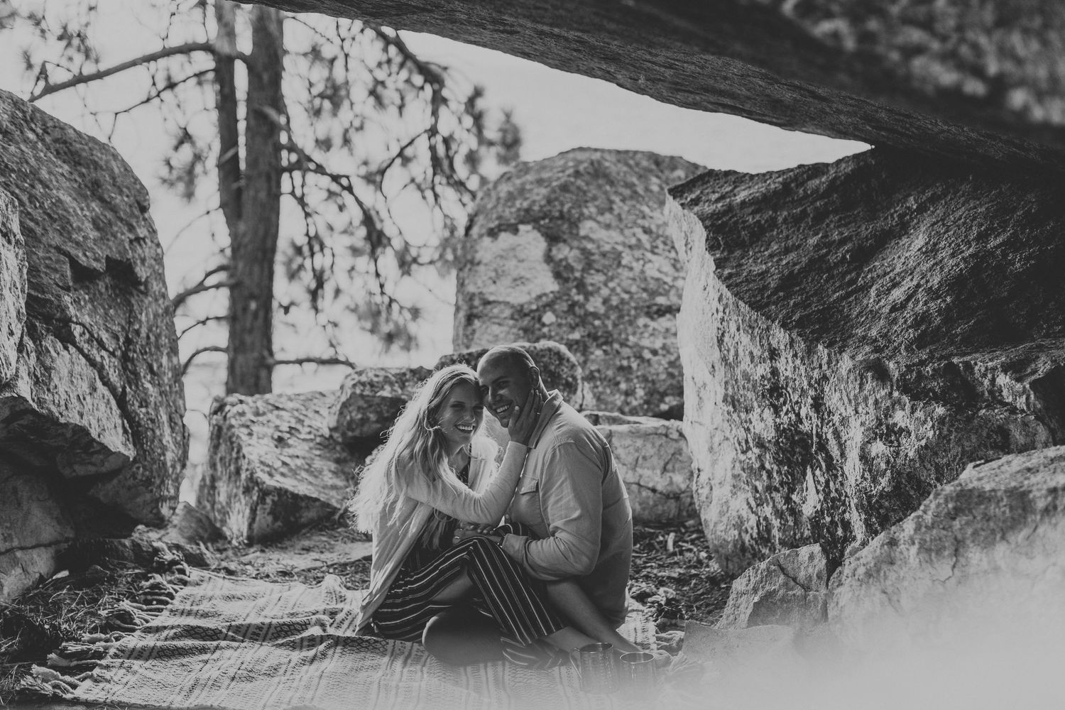 Romantic couple photoshoot in a dramatic rocky mountain landscape.