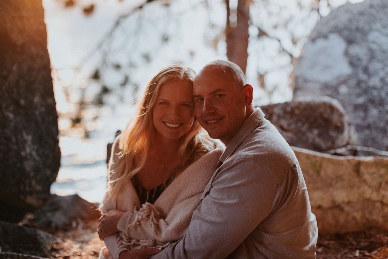 Couple enjoying intimate moment together during golden hour photoshoot.