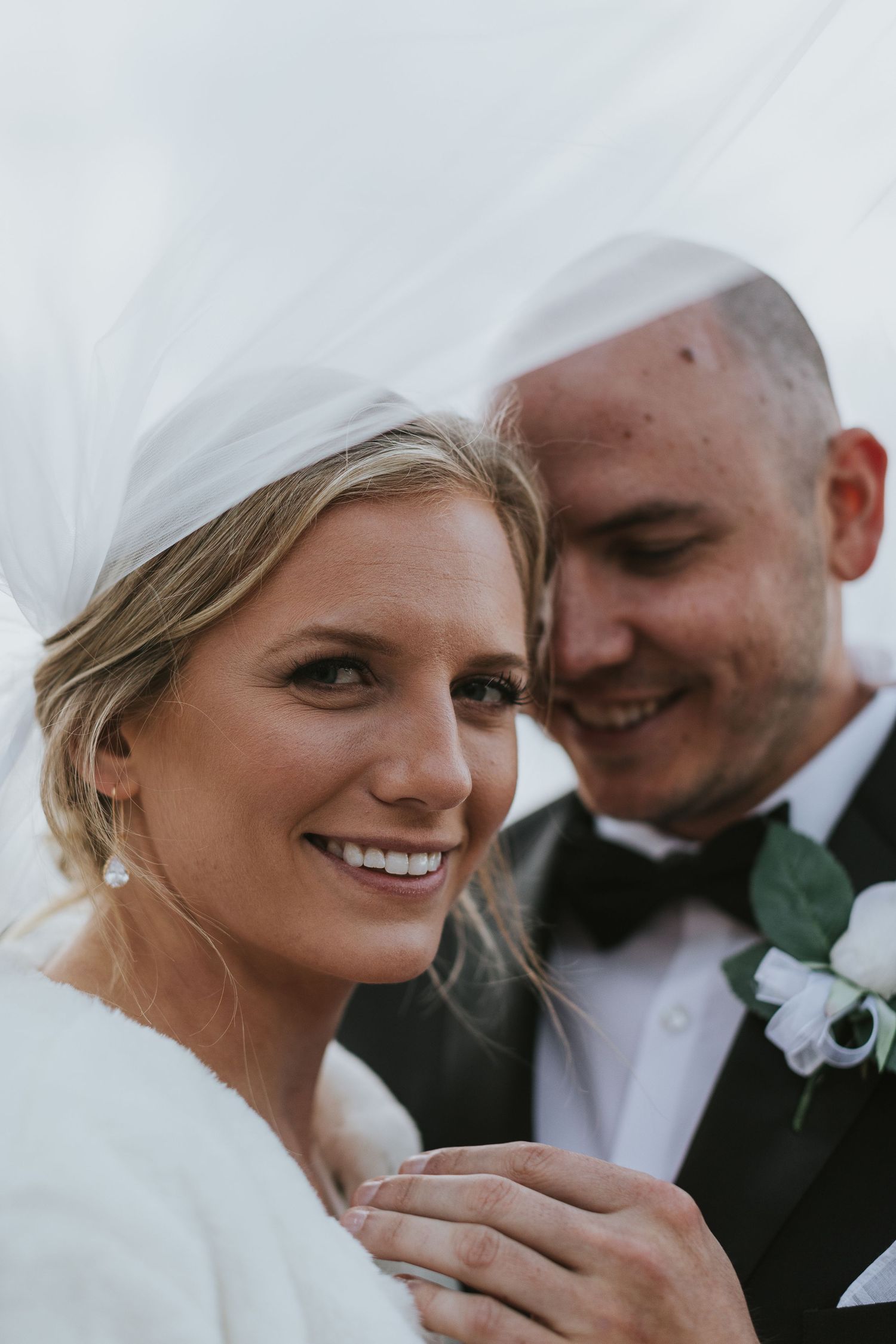 Intimate wedding portrait moments captured in soft natural light.