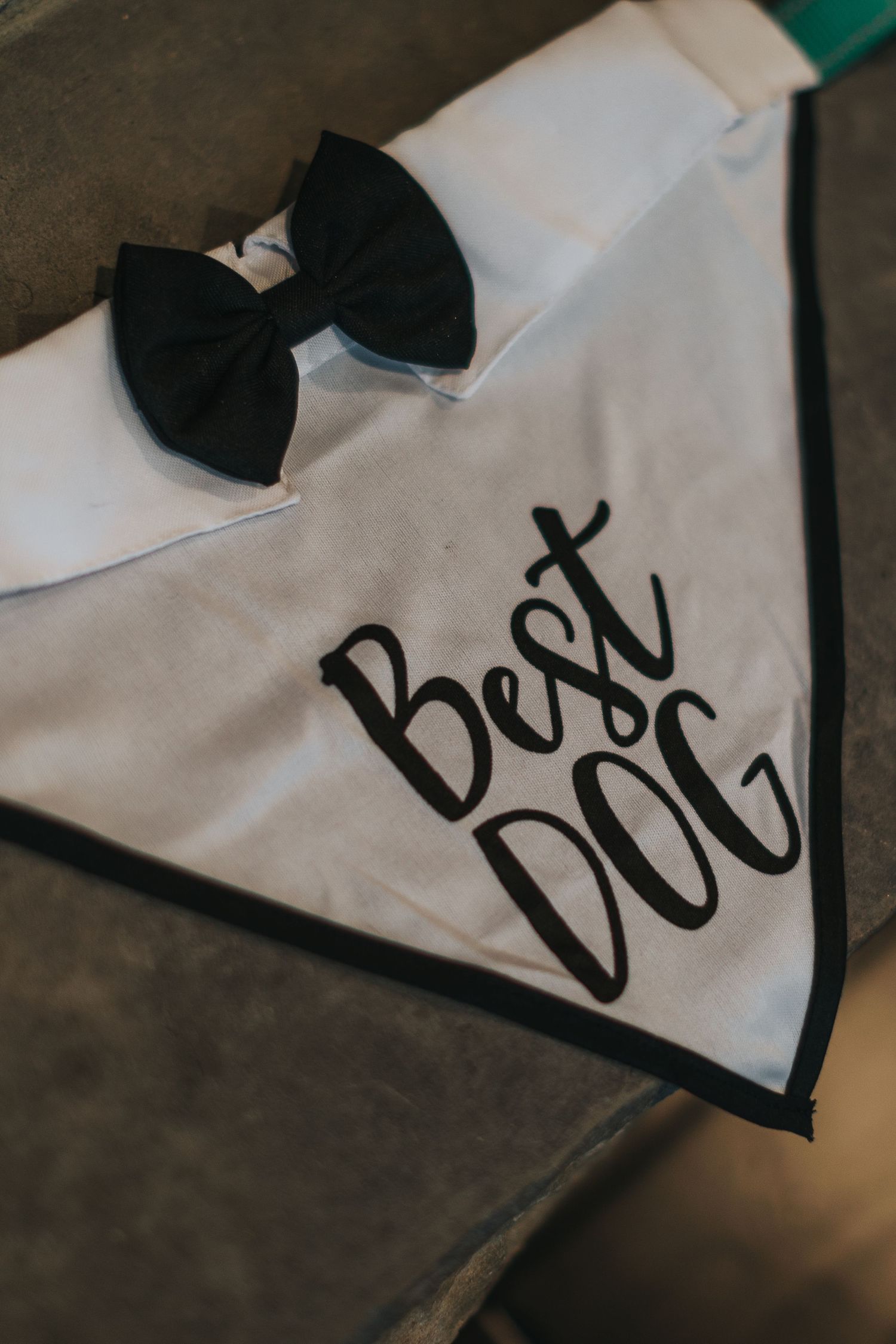 Close-up of black text being written on white fabric.