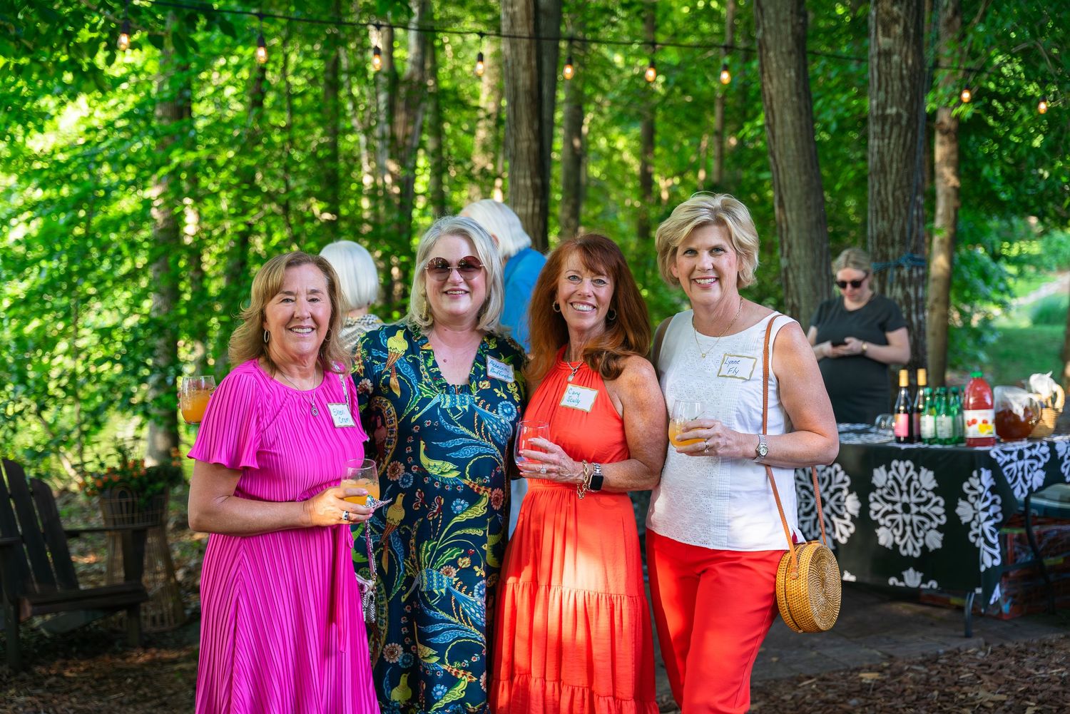 Event photograph of a group of women smiling for the camera.