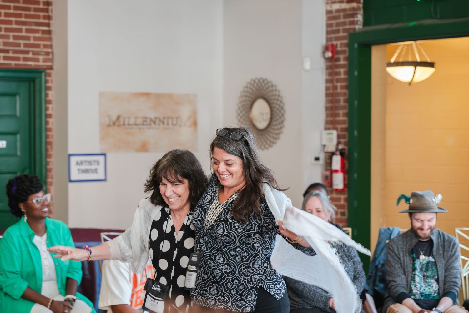 Event photograph of two women dancing.
