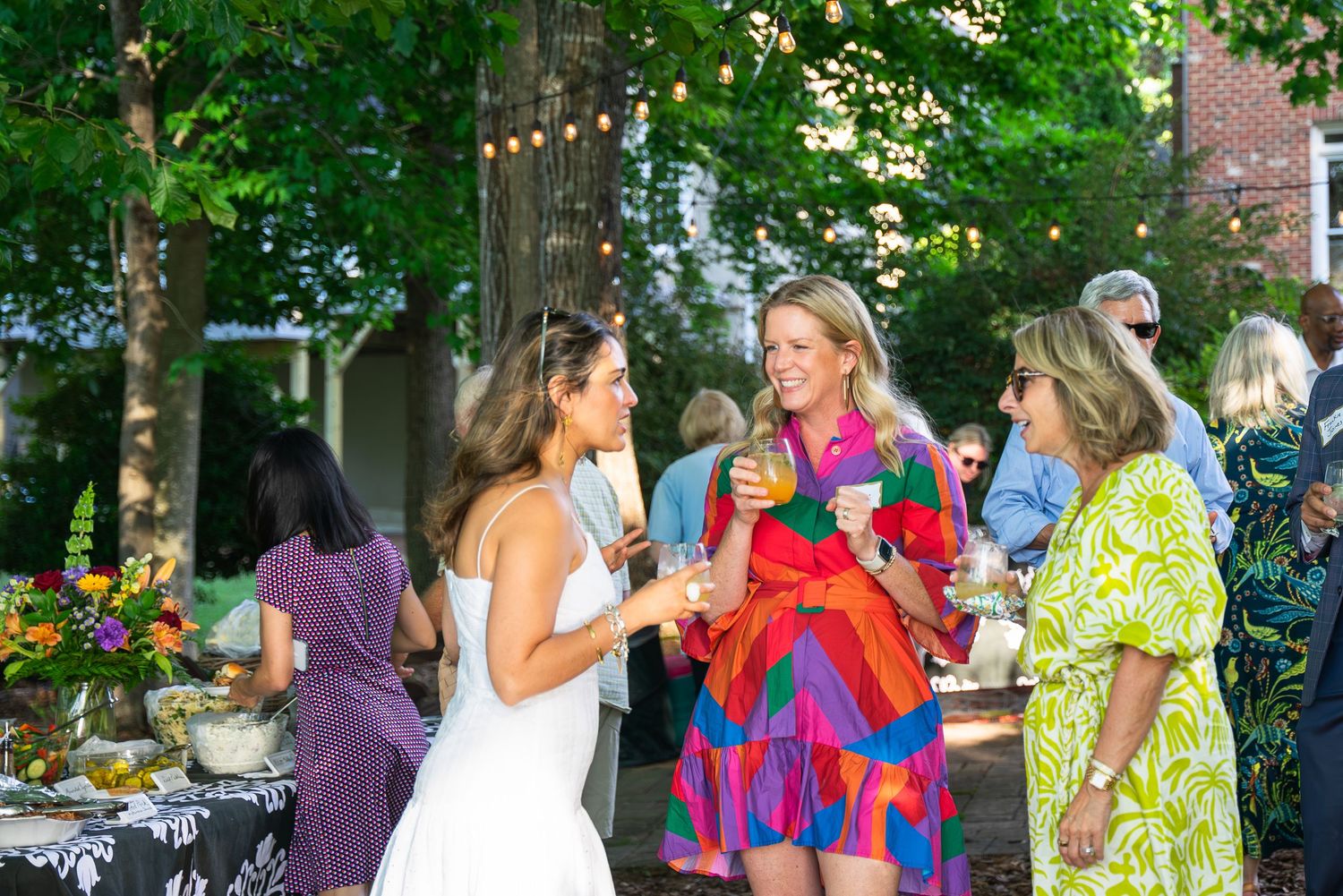Event photograph of a group of women talking.
